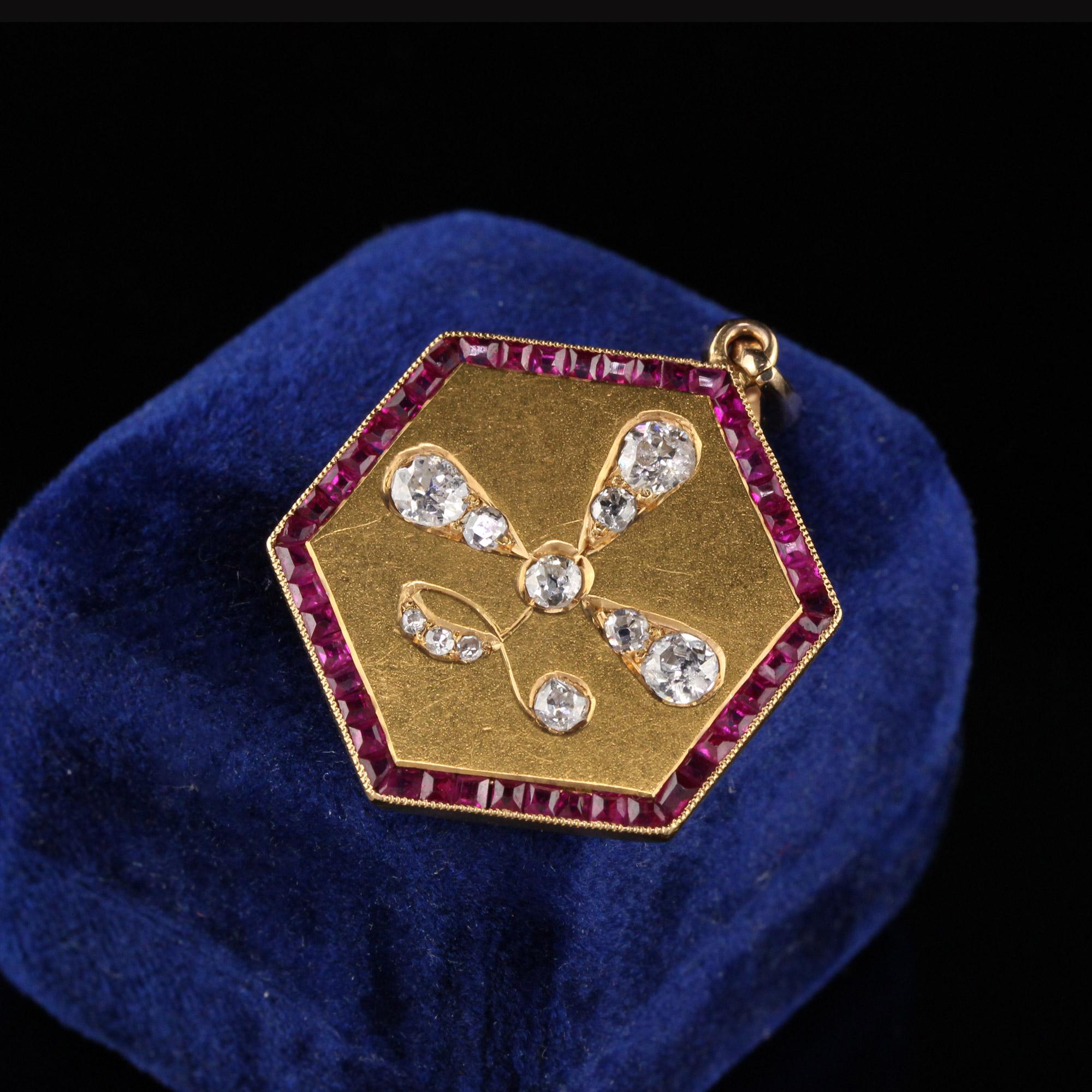 Beautiful antique pendant with rubies and old cut diamonds. 

Item #N0035

Metal: 14K Yellow Gold

Weight: 10 Grams

Total Diamond Weight: Approximately 1.00 cts

Diamond Color: H

Diamond Clarity: VS2

Measurements: 40.7 mm x 2.05 mm