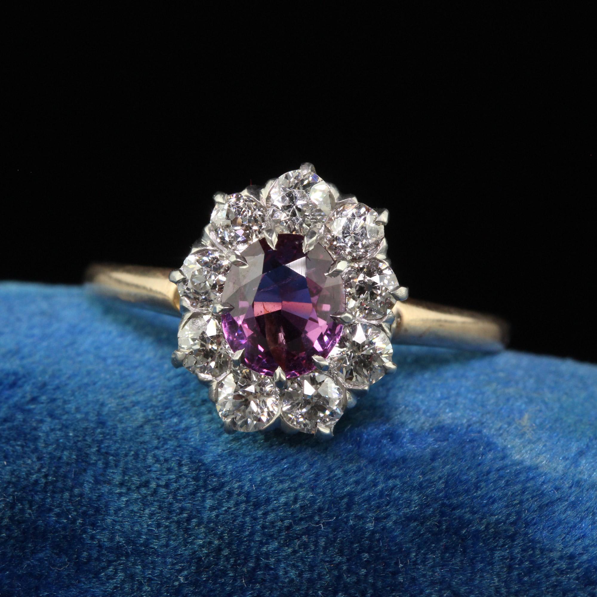 Antique Edwardian 14K Yellow Gold Diamond Sapphire Cluster Engagement Ring - GIA. This beautiful pink sapphire engagement ring is crafted in 14k yellow gold. The center holds a natural Pink-Purple sapphire that has a GIA report. The natural sapphire
