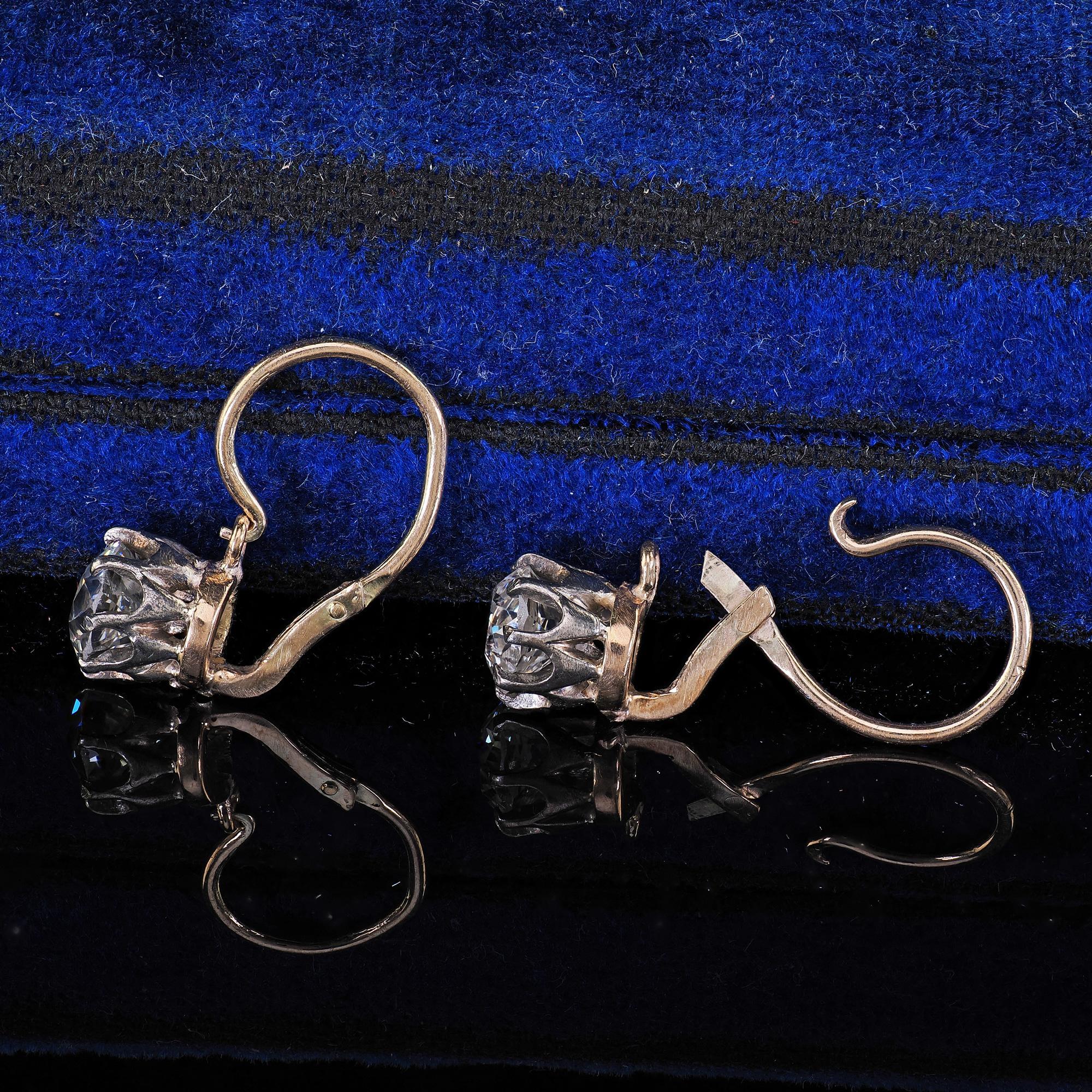 Beautiful Antique Art Deco 14K Yellow Gold Old European Cut Diamond Drop Earrings. This incredible pair of Art Deco old European cut diamond drop earrings are crafted in 14k yellow gold and white gold. The earrings feature bright old European cut