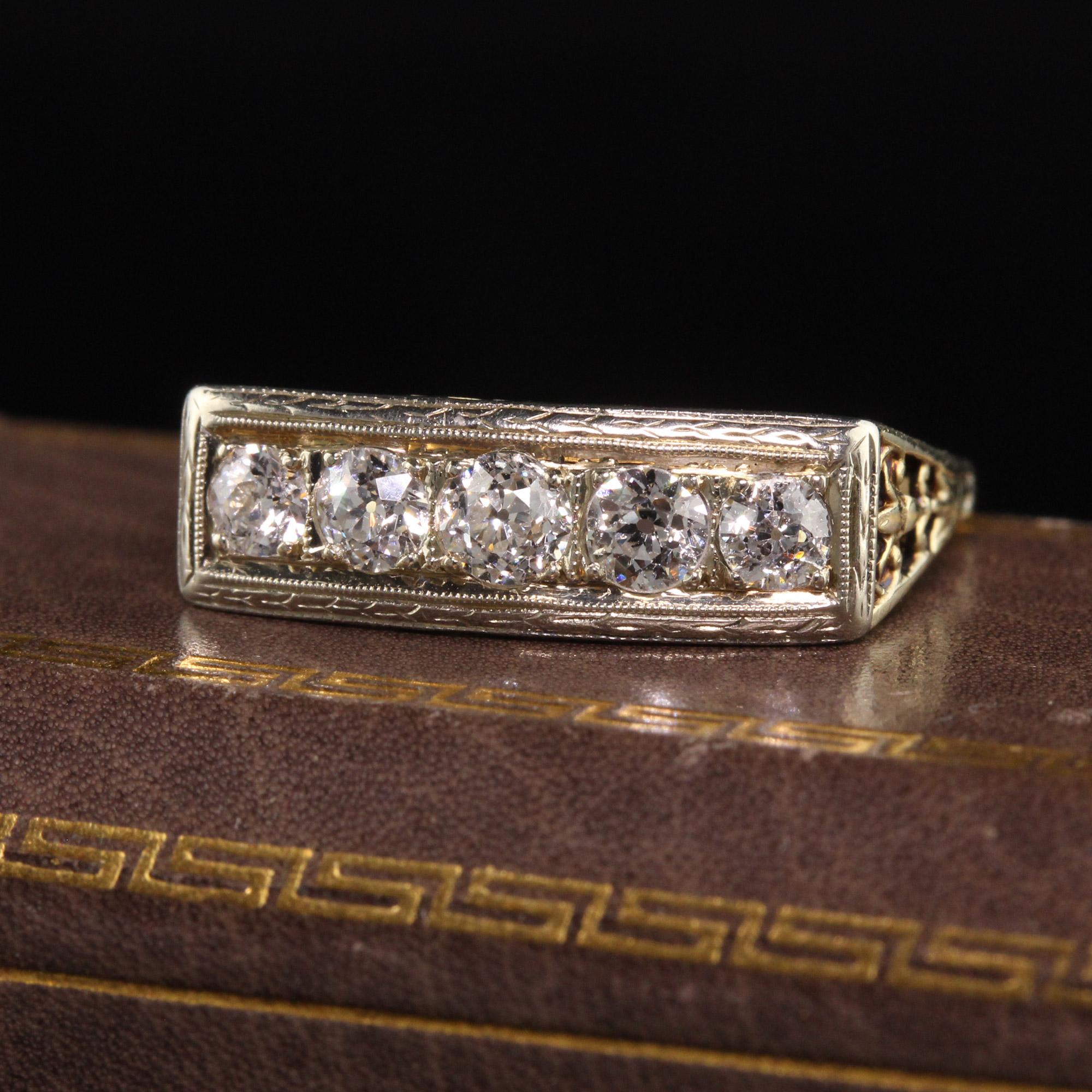 Beautiful Antique Art Deco 14K Yellow Gold Old European Five Stone Diamond Ring. This gorgeous ring is crafted in 14k yellow gold. The ring holds five old european cut diamonds on top with gorgeous filigree and engravings.

Item #R1345

Metal: 14K