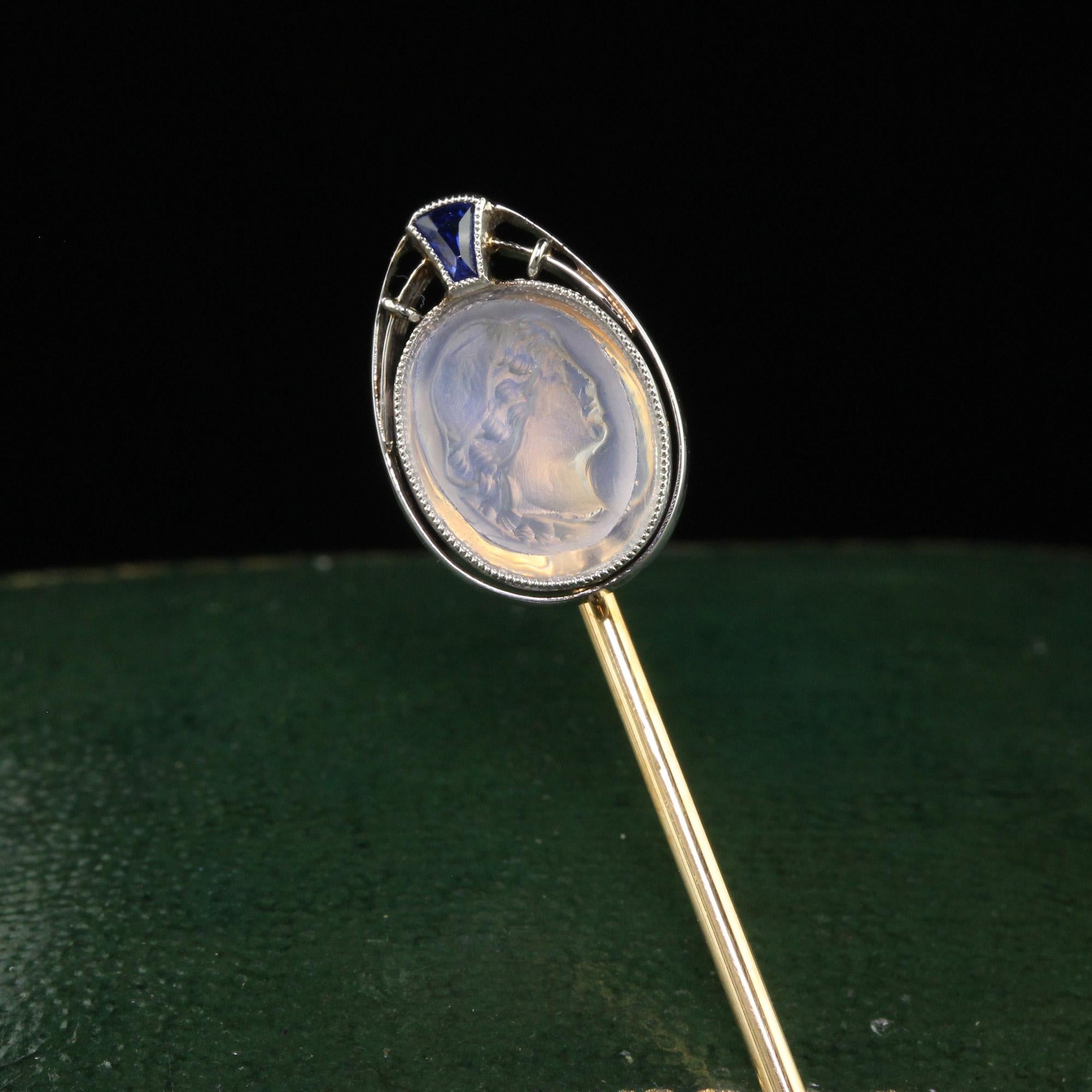 Beautiful Antique Art Deco 14K Yellow Gold Platinum Carved Moonstone Lady Stick Pin. This incredible Art Deco stick pin is crafted in 18k yellow gold and platinum. This pin features a portrait of a lady carved out of moonstone and has a synthetic