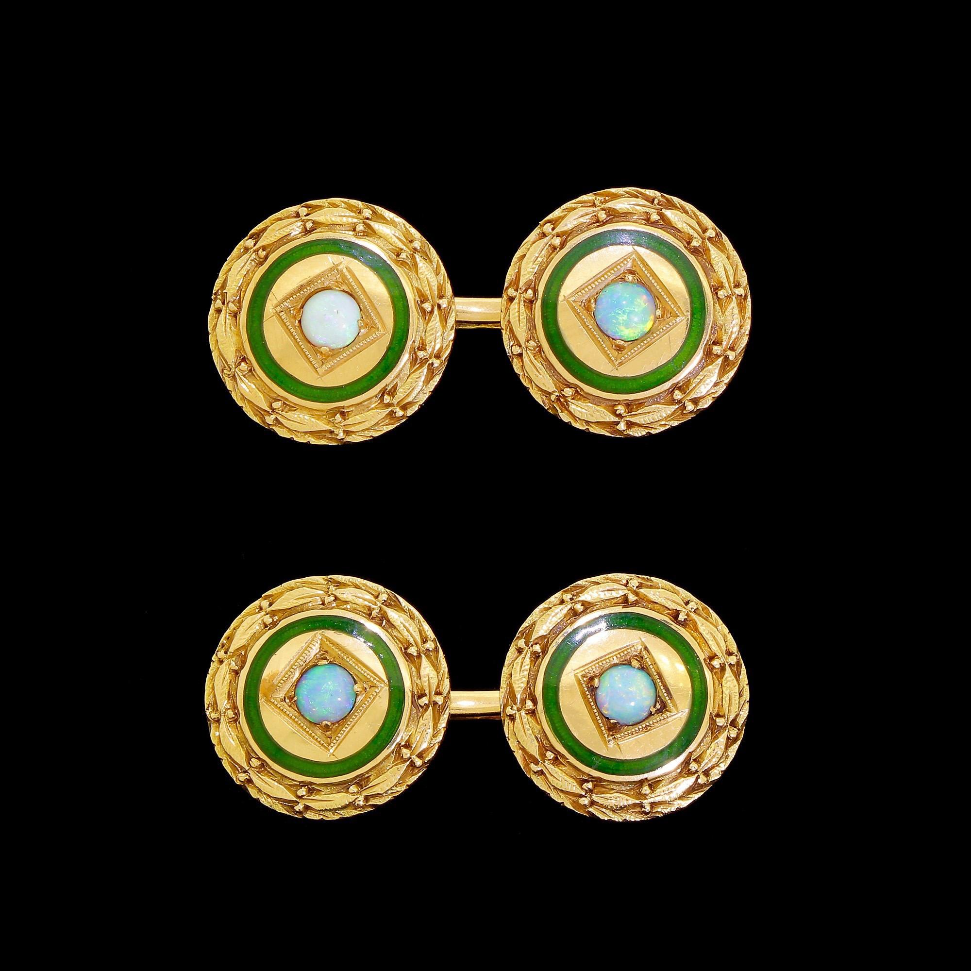 Exquisite 14K yellow gold Art Deco cufflinks with Australian fire opal cabochons. Each cufflink has dual round panels with bar type connection. The panels consist of a bezel set around a cabochon of genuine opal. Each fire opal is surrounded by a