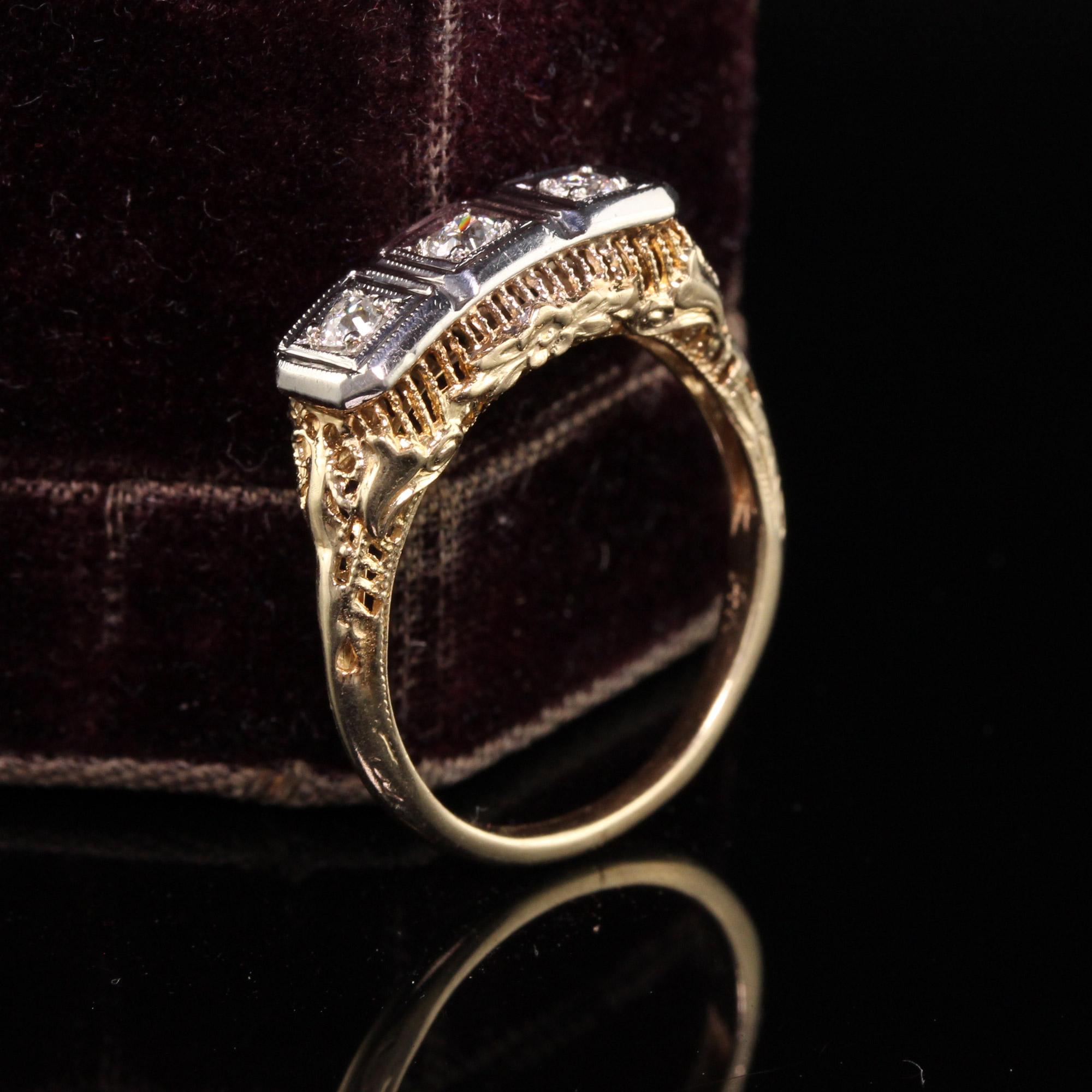 Beautiful Antique Art Deco 14K Yellow Gold Three Stone Diamond Filigree Ring. This gorgeous ring is in incredible condition and features 3 old european cut diamonds on the top.

Item #R0909

Metal: 14K Yellow Gold and White Gold Top

Weight: 2.8