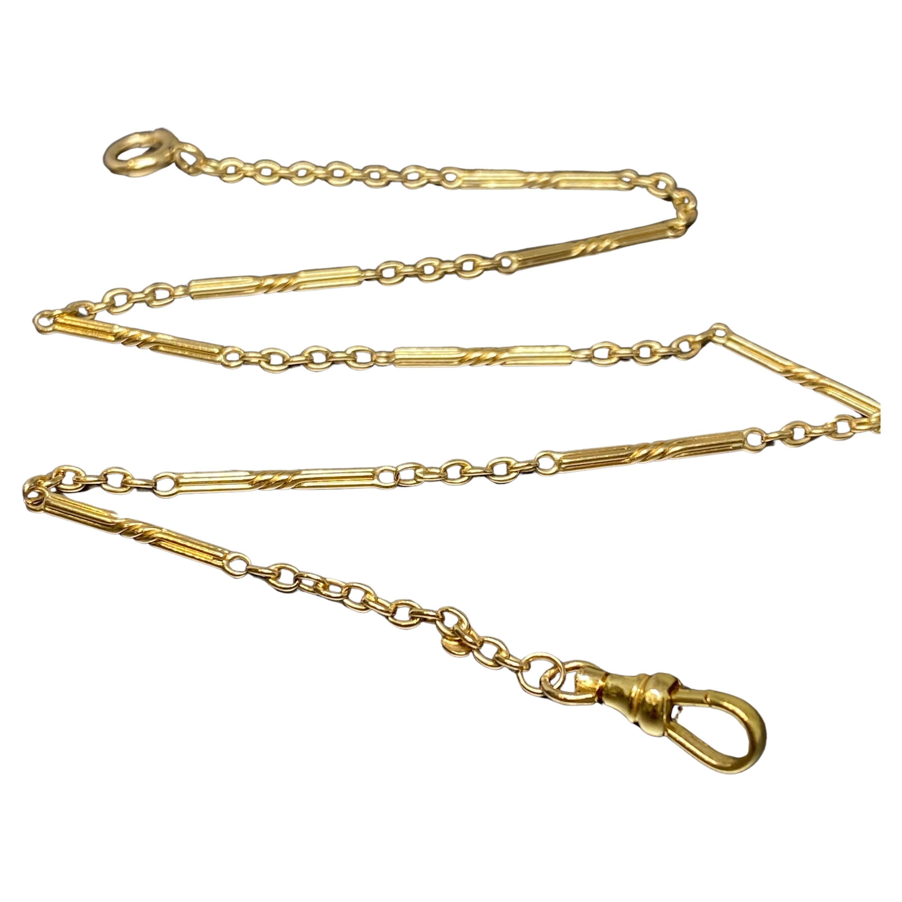 This early 20th century Art Deco fancy link watch chain has been crafted in 14k yellow gold.

The chain consists of alternating segments of gold fancy elongated links, alternating with six smaller rounded links in between.

The watch chain is fitted