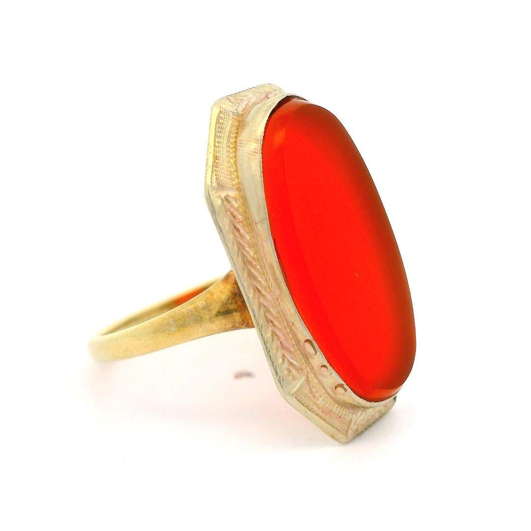 –Stone(s)–
(1) Natural Genuine Carnelian - Oval Cut - Bezel Set - Deep Orange Color  - 19.08 x 9.68mm (approx.)

Material: 14k Yellow Gold Band w/ White Gold Top
Weight: 3.41 Grams
Ring Size: 7.5 ( fitted on finger, please contact us prior to