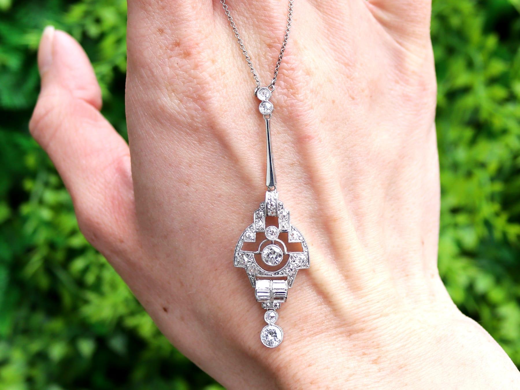A stunning, fine and impressive antique 1.67 carat diamond, 18 karat white gold and platinum set Art Deco pendant; part of our diverse antique Art Deco jewelry collections.

This stunning, fine and impressive diamond pendant has been crafted in 18k