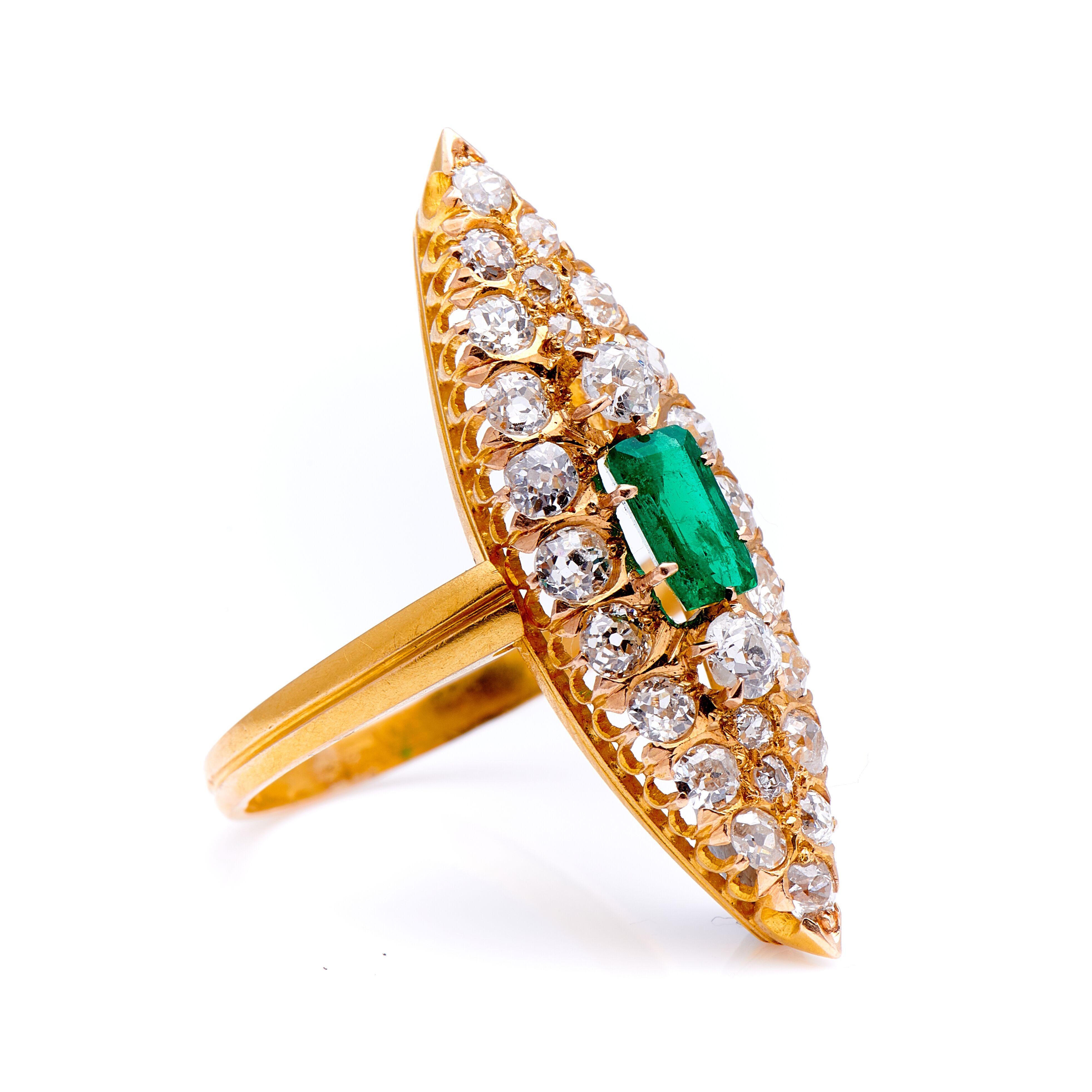 Art Deco, emerald and diamond cluster ring, circa 1920. Set to centre a deep green emerald-cut emerald further set with beautiful old-cut diamonds in a marquise shape cluster. The emerald is a fresh vivid colour with very good saturation, it’s not