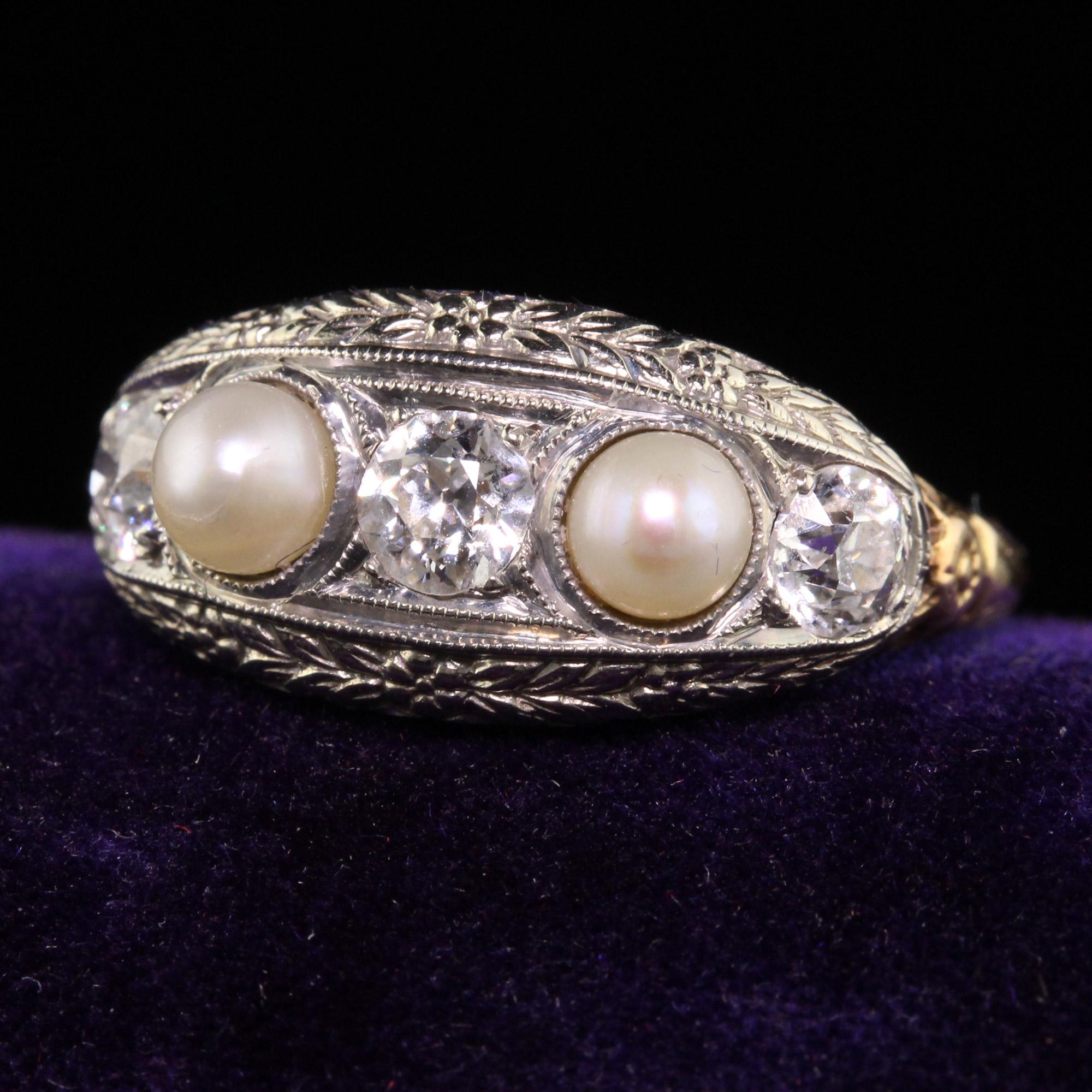 Beautiful Antique Art Deco 18K and 14K Yellow Gold Old Euro Diamond Natural Pearl Ring. This gorgeous five stone ring is crafted in 14k yellow gold and 18k white gold top. The ring has three beautiful old european cut diamonds and two natural