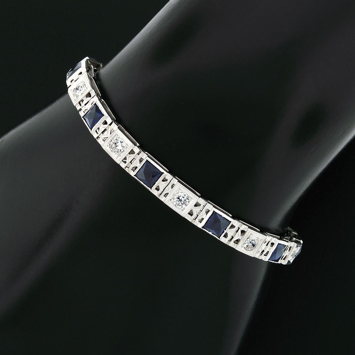 Here we have a gorgeous art deco period bracelet crafted from solid 18k white gold and features alternating diamonds and synthetic sapphires throughout the straight line design. The diamonds are old European cut stones totaling approximately 1.10