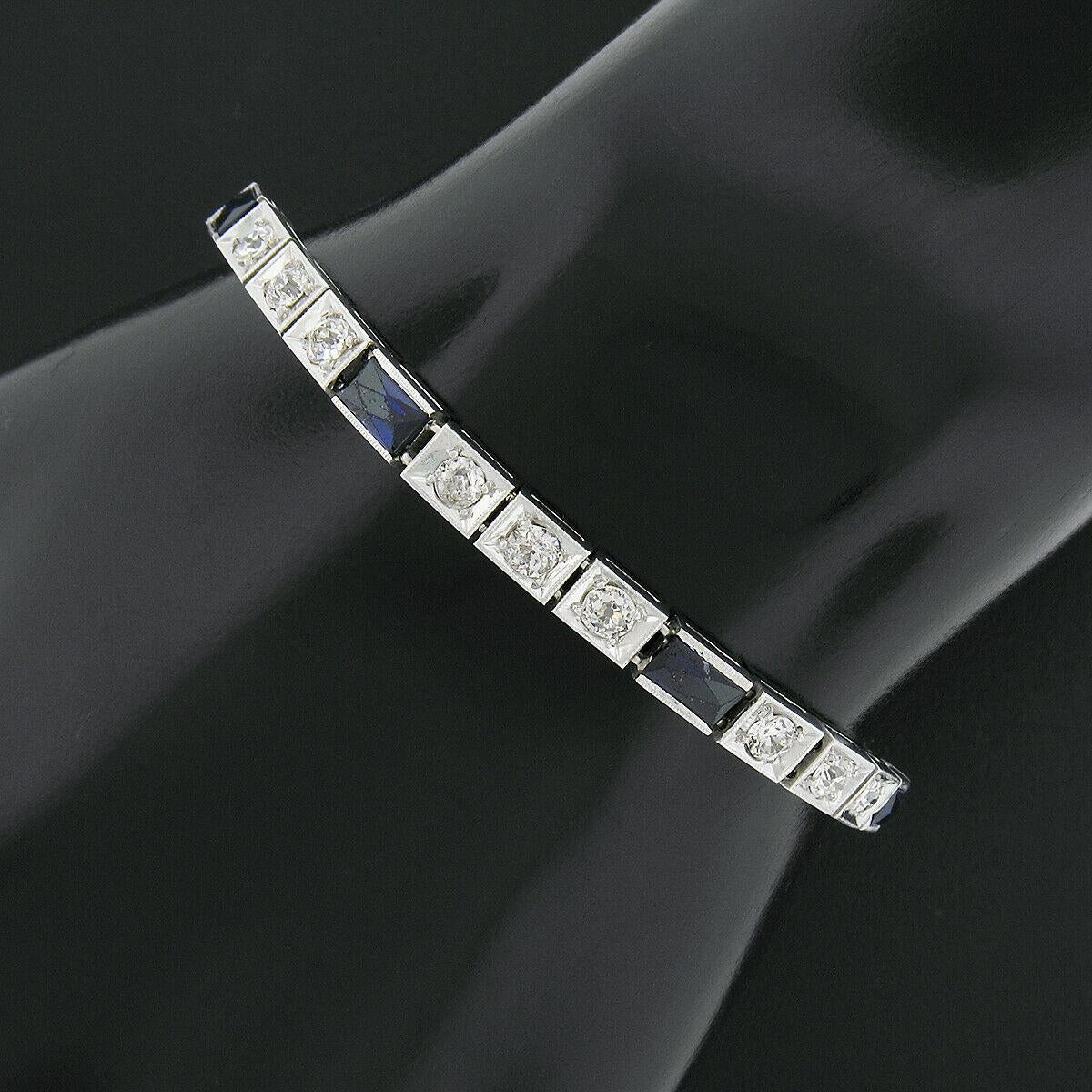 Here we have a gorgeous antique line bracelet crafted from solid 18k white gold during the art deco period. It features trios of bead set old European cut diamonds separated by channel set rectangular French cut synthetic sapphires. The 18 diamonds