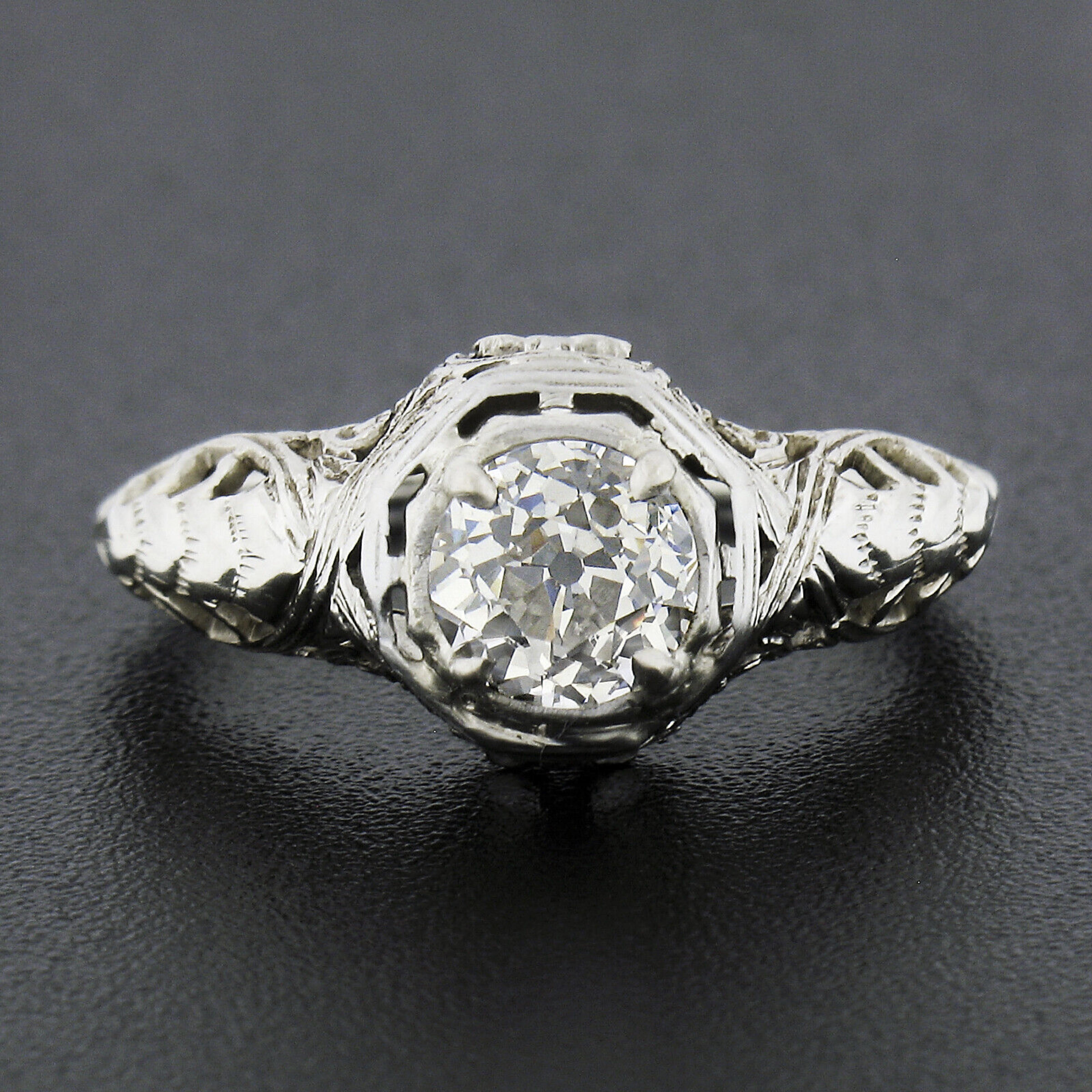 You are looking at a truly magnificent and gorgeous art deco period engagement ring that is crafted in solid 18k white gold, featuring a stunning old European cut diamond solitaire neatly prong set at its center. The lively diamond is a nice large