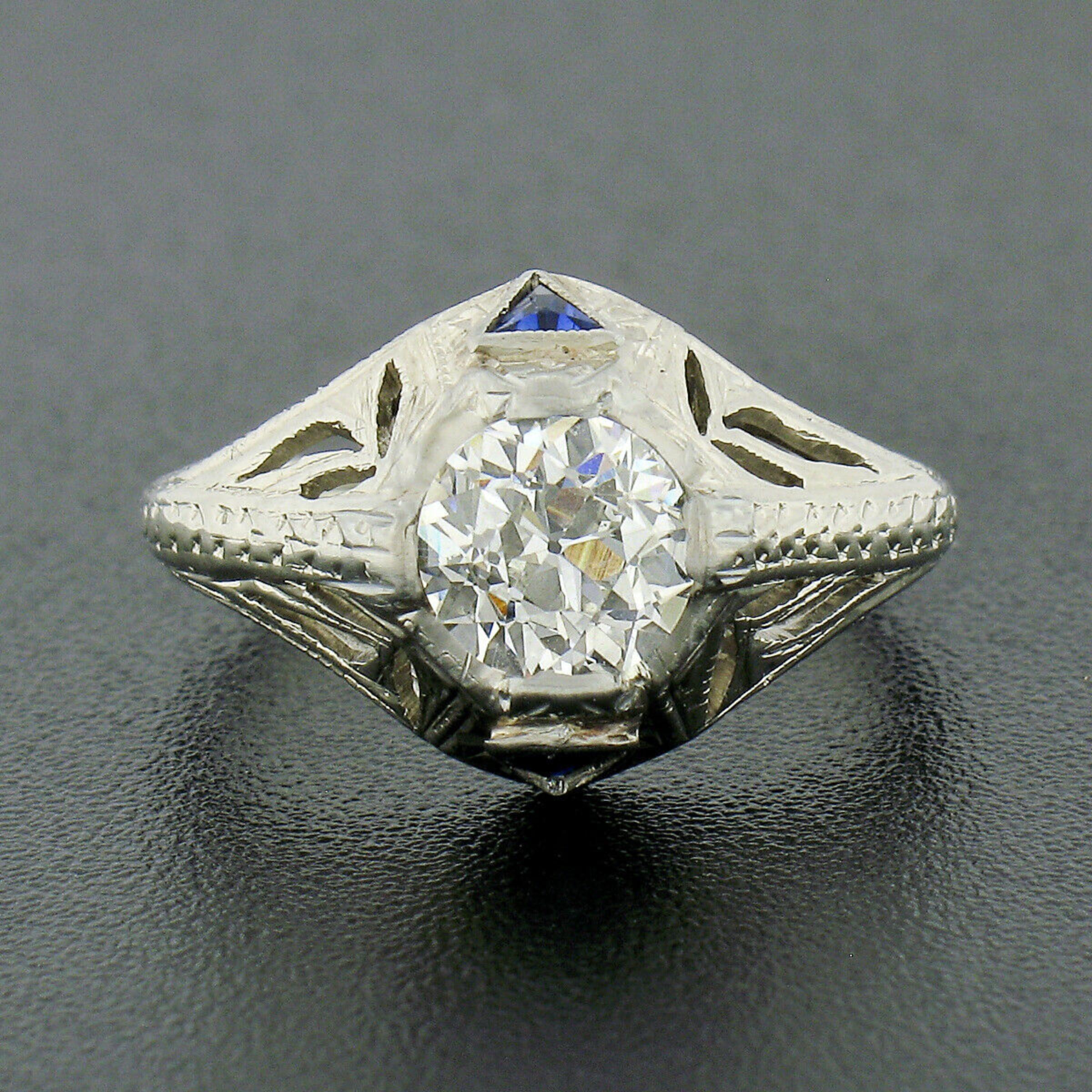 This beautiful antique diamond engagement ring was crafted from solid 18k white gold during the art deco period and features an old European cut diamond neatly prong set at its center. The diamond is GIA certified as being exactly 0.84 carats and