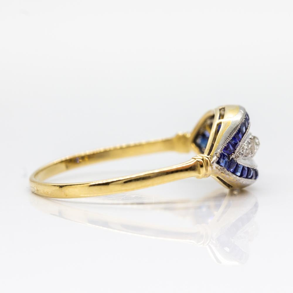 Period: Art Deco (1920-1935)
Composition: 18k Gold & Platinum
•	5 rose cut diamonds J-SI2 0.20ctw.
•	32 natural sapphires 0.80ctw
Ring size: 7
Ring face measure: 8mm by 16mm
Rise above finger: 5mm
Total weight: 1.5 grams – 1.0dwt
