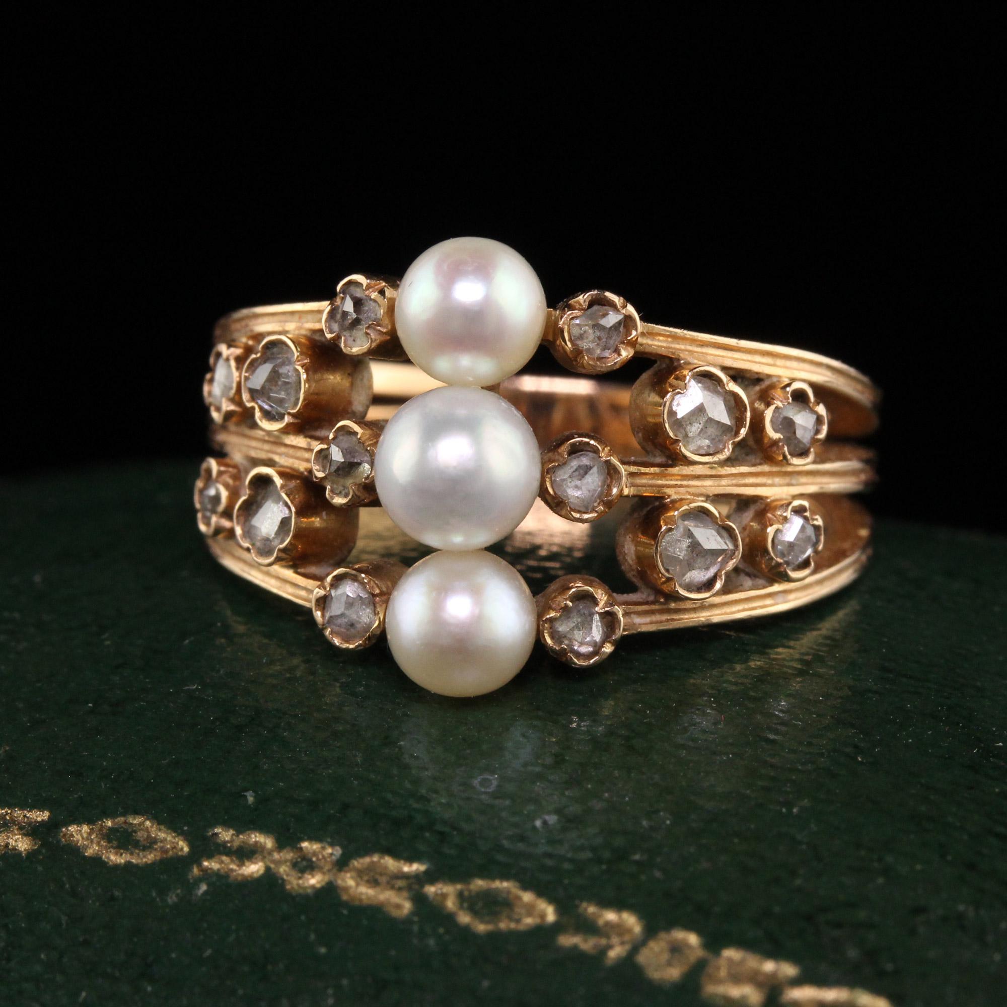 Beautiful Antique Art Deco 18K Rose Gold Pearl and Rose Cut Diamond Ring. This beautiful ring is crafted in 18k rose gold. The center holds 3 beautiful pearls and has rose cut diamonds on each side in a beautiful pattern. The ring is in great