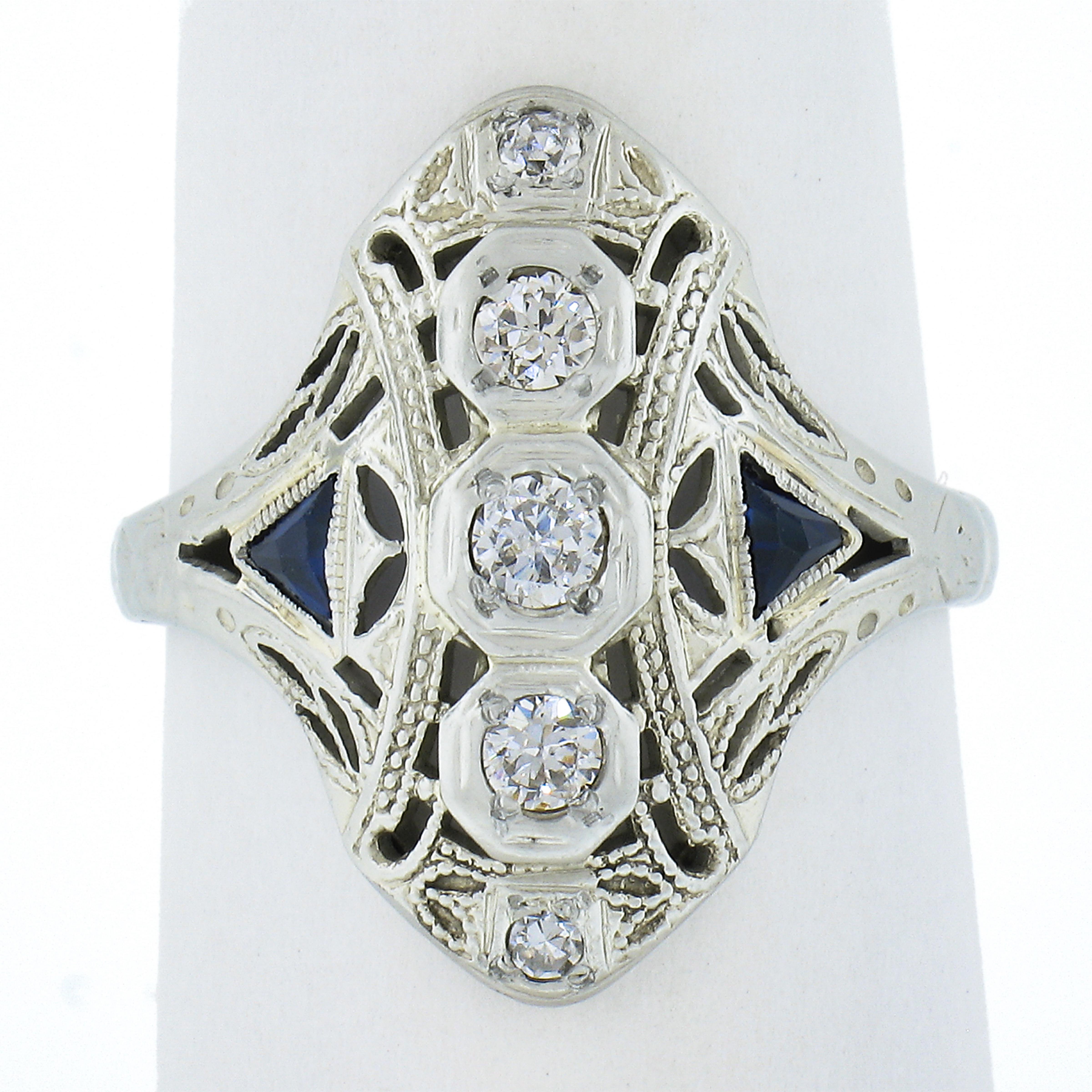 This outstanding antique dinner ring was crafted during the art deco period in solid 18k white gold. All original and screams Art Deco!. Enjoy!

--Stone(s):--
(5) Natural Genuine Diamonds - Old European & Single Cut - Prong Set - VS1/VS2 Clarity - G