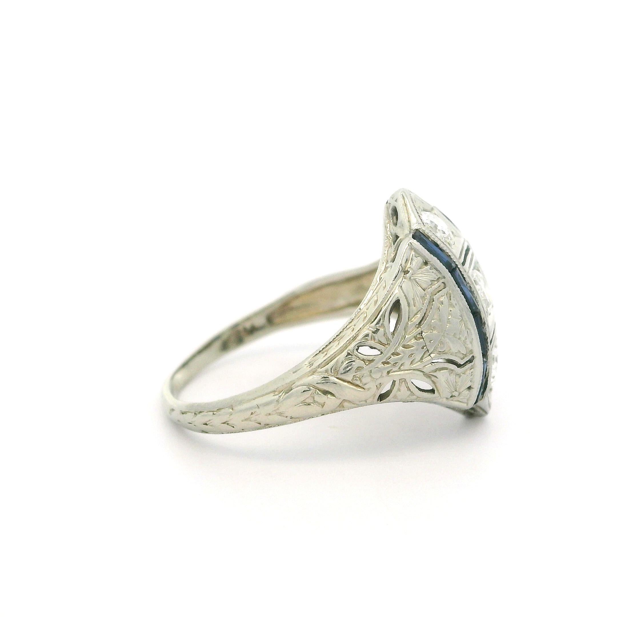 –Stone(s)–
(3) Natural Genuine Diamonds - Old European Cut - Pave Set - G/H Color - VS1/VS2 Clarity - 0.33ctw (approx.)
(8) Synthetic Sapphires - Baguette French Cut - Channel Set - Dark Blue Color

Material: Solid 18k White Gold
Weight: 2.89