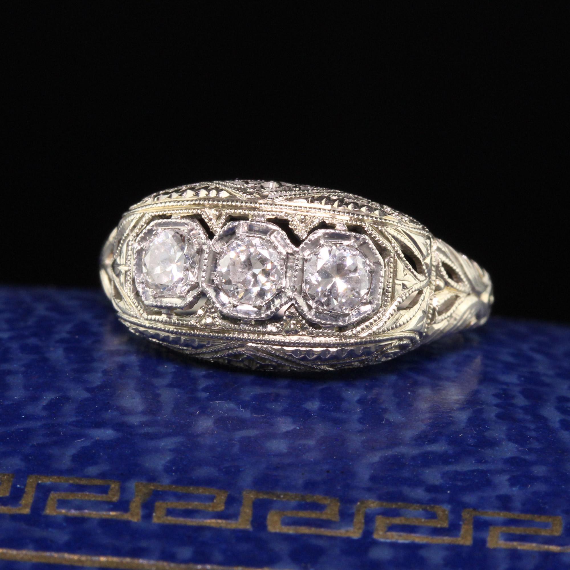 Beautiful Antique Art Deco 18K White Gold and Platinum Old Euro Diamond Three Stone Ring. This gorgeous Art Deco ring is crafted in 18K white gold and platinum top. It has 3 old european cut diamonds that are white and clean in a filigree