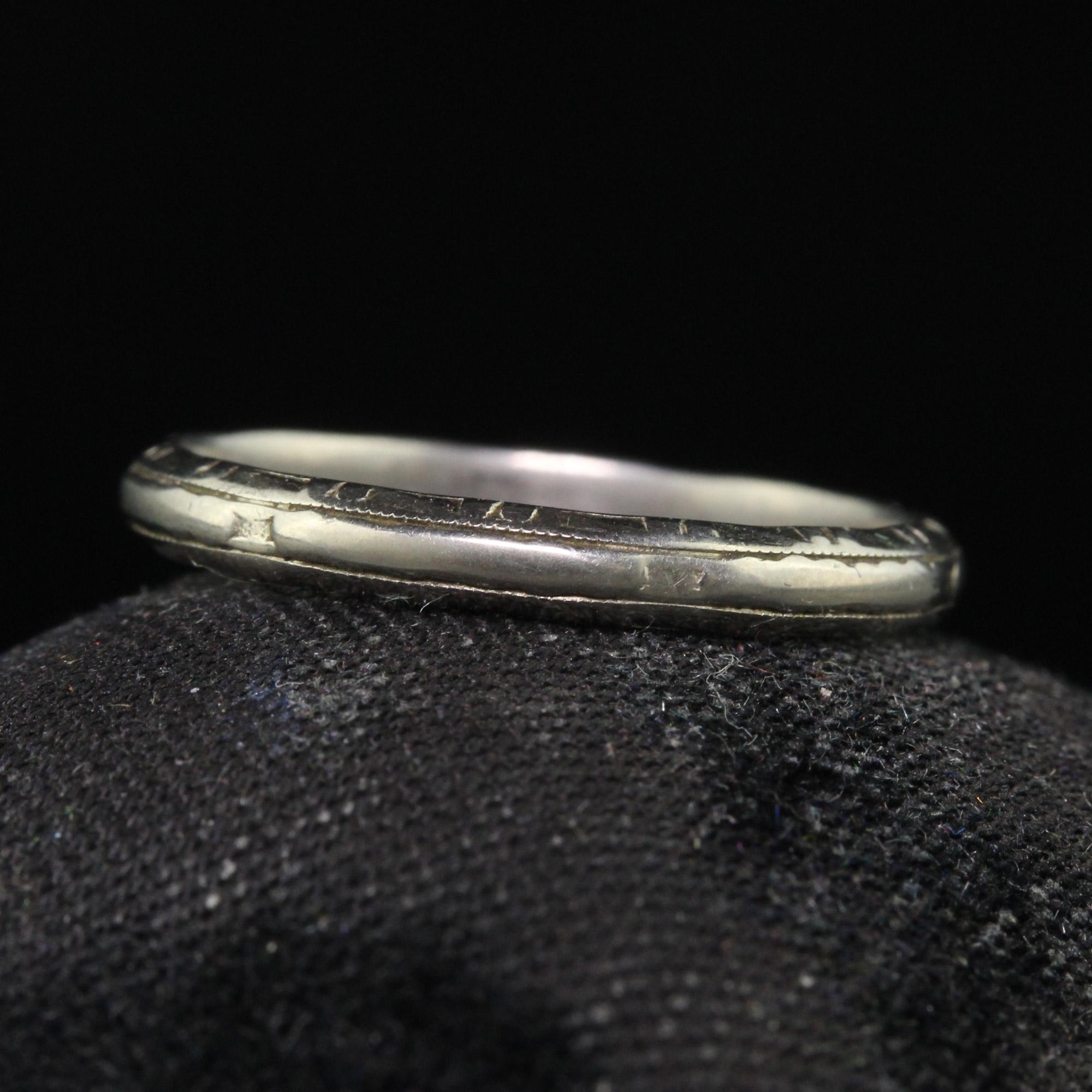 Beautiful Antique Art Deco 18K White Gold Classic Engraved Wedding Band - Size 6. This classic wedding band is crafted in 18k white gold. The sides of the band are engraved and they go around the entire ring on both sides. The top has a rounded