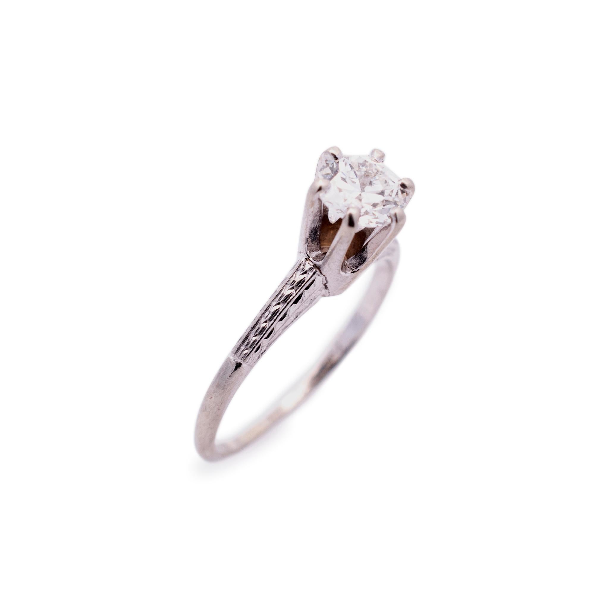 Gender: Ladies

Metal Type: 18K White Gold

Ring Size: 5.5

Total weight: 2.30 grams

Ladies 18K white gold diamond solitaire engagement vintage ring with a half round shank. Engraved with 