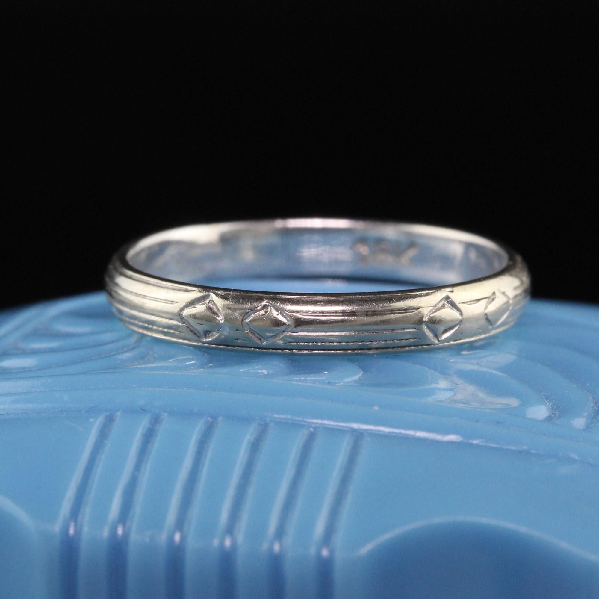 Beautiful Antique Art Deco 18K White Gold Engraved Wedding Band. This gorgeous wedding band is crafted in 18K white gold and has engravings going around the entire ring.

Item #R1191

Metal: 18K White Gold

Weight: 1.6 Grams

Size: 5

Measurements: