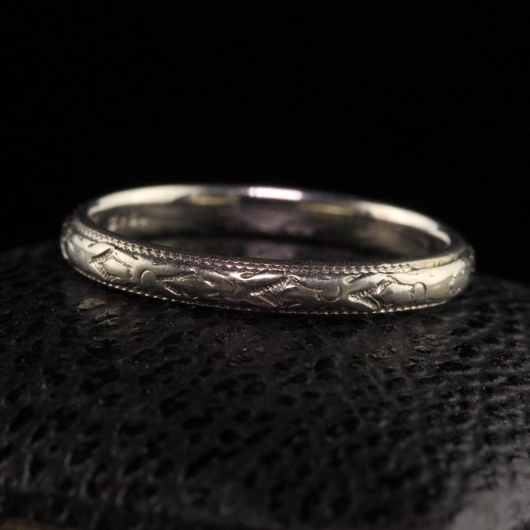 Beautiful Antique Art Deco 18K White Gold Engraved Wedding Band - Size 5. This beautiful wedding band is crafted in 18k white gold. The ring is beautifully engraved around the entire ring and is in great condition.

Item #R1472

Metal: 18K White