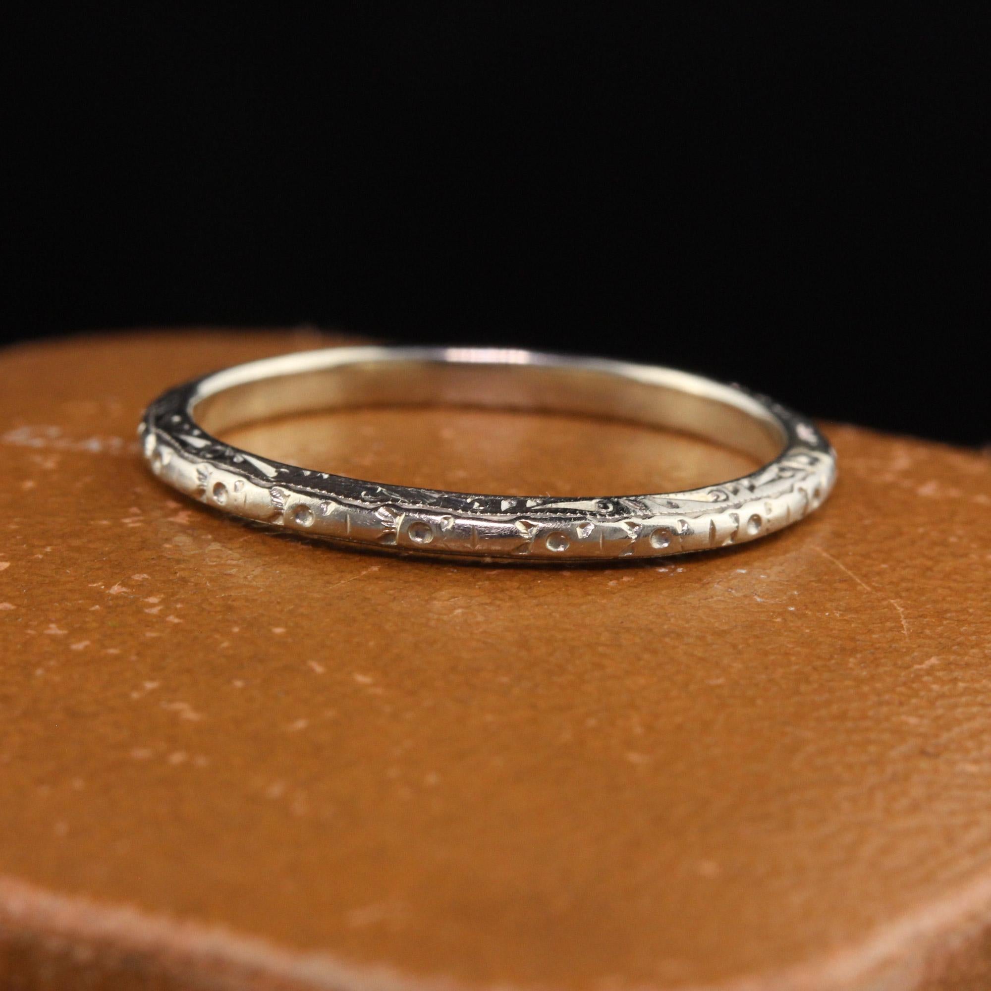 Beautiful Antique Art Deco 18K White Gold Engraved Wedding Band - Size 6 1/2. This beautiful wedding band is crafted in 18k white gold. The band is nicely engraved around the entire ring and is in good condition.

Item #R1266

Metal: 18K White