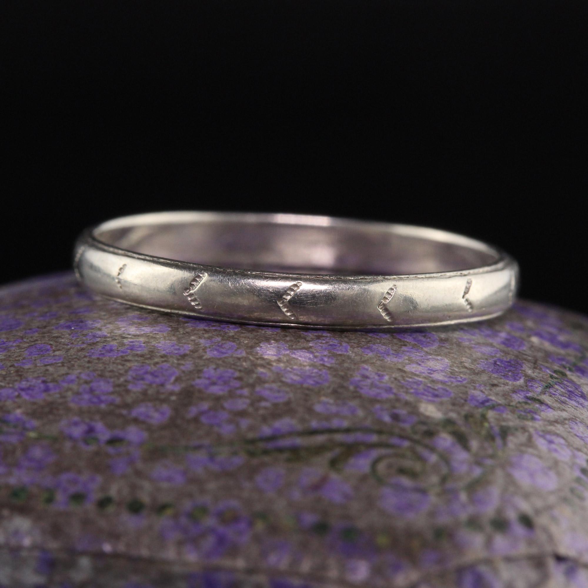 Beautiful Antique Art Deco 18K White Gold Engraved Wedding Band - Size 6. This classic wedding band is crafted in 18k white gold. The band has light engravings going around the entire ring.

Item #R1273

Metal: 18K White Gold

Weight: 1.4