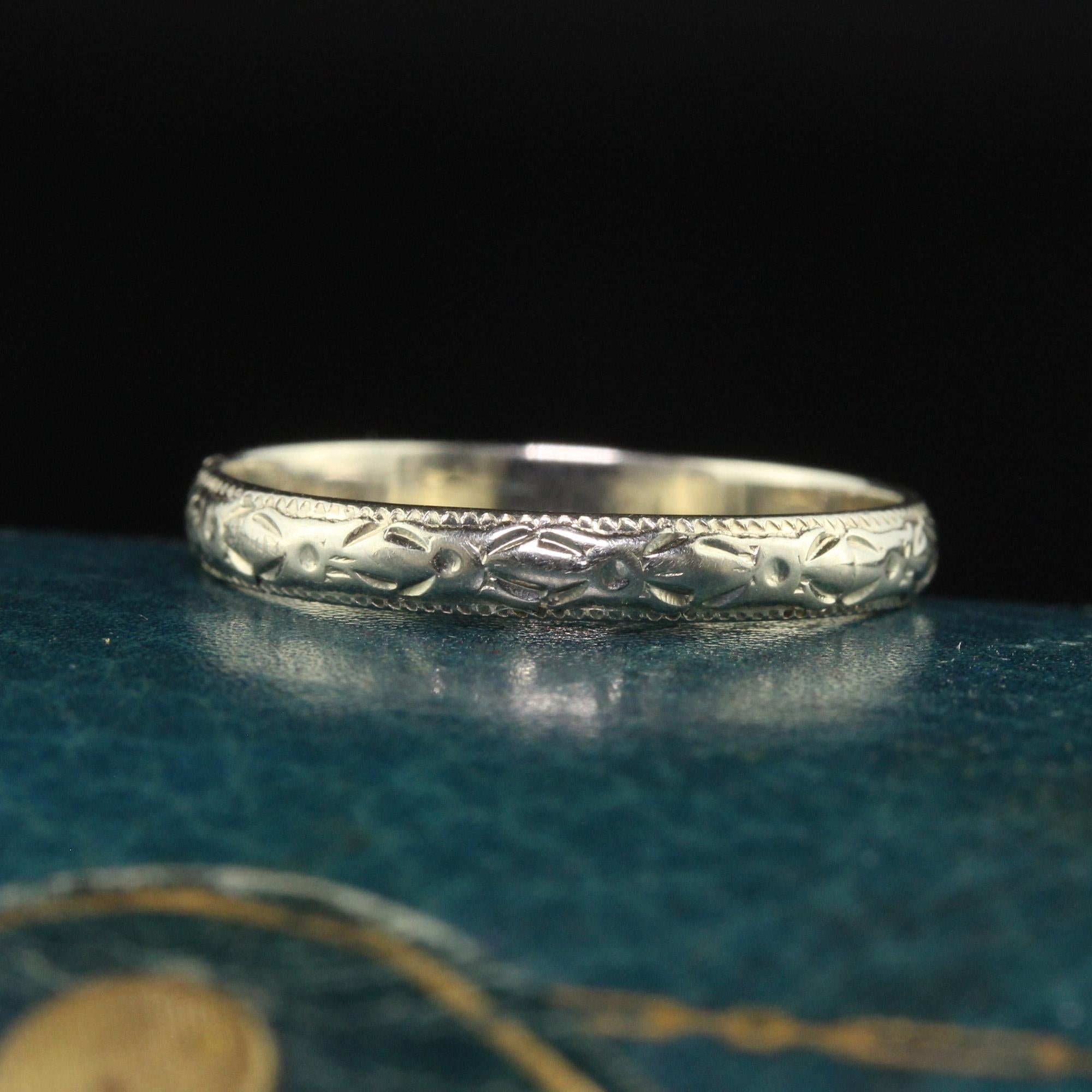 Beautiful Antique Art Deco 18K White Gold Engraved Wedding Band - Size 6. This incredible wedding band is crafted in 18k white gold. The band is engraved around the entire ring and is in great condition. The band sits low on the finger and can be