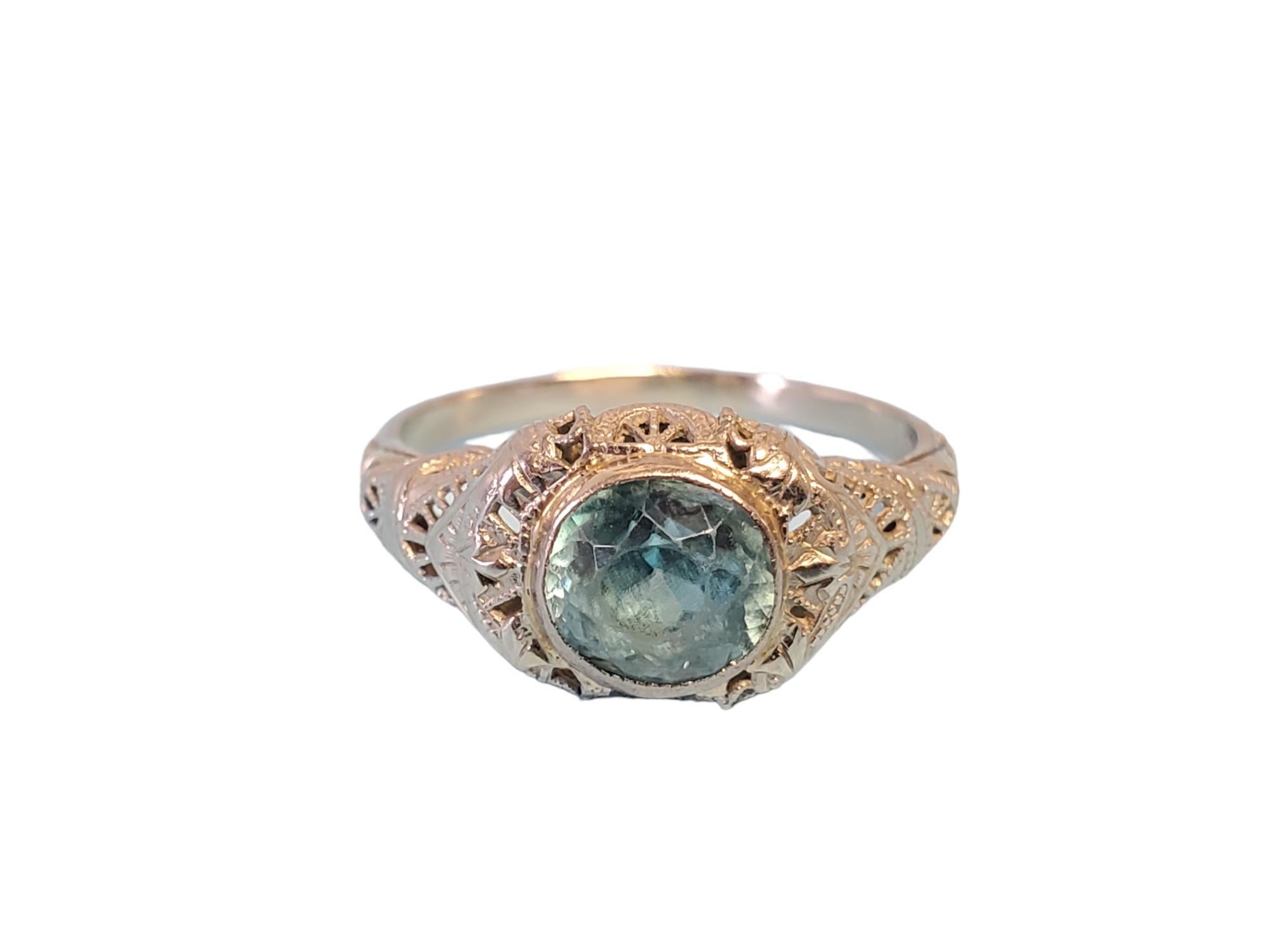 Listed is an antique Deco 18k white gold ring with a 7.5mm blue zircon center. The stone has some abrasions from age but I can't see it without magnification. The ring is in very good condition with no issues. Size 8