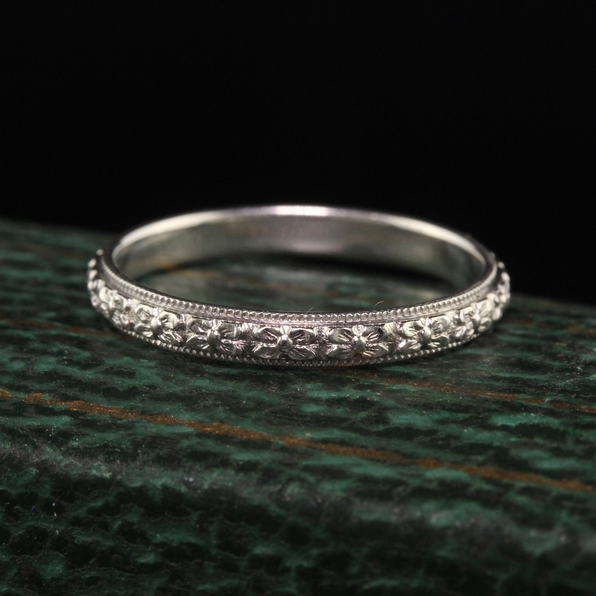 Beautiful Antique Art Deco 18K White Gold Floral Engraved Wedding Band. This gorgeous wedding band is crafted in 18K white gold and is in incredible condition considering its age! It has floral engravings going around the entire band.

Item