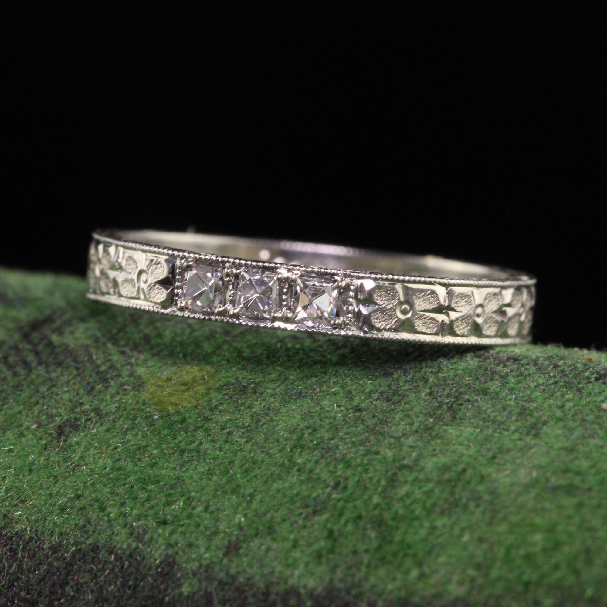 Beautiful Antique Art Deco 18K White Gold Mayflower French Cut Diamond Wedding Band - Size 5 1/2. This beautiful wedding band is crafted in white gold. The ring has french cut diamonds on the top of the ring with deep engravings going around the