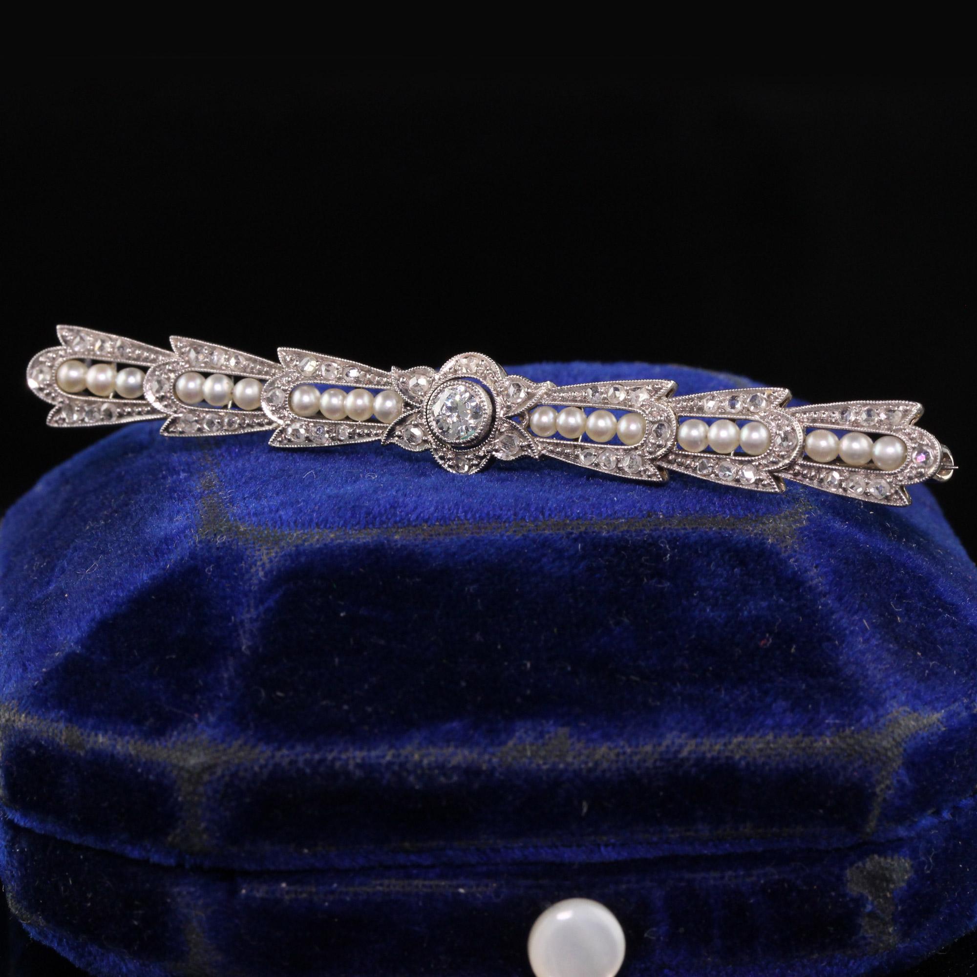 Beautiful Antique Art Deco 18K White Gold Old European Diamond Rose Cut Pearl Pin. This incredible pin has rose cuts set in a beautiful design with a bright old european cut diamond in the center. The pin also has natural seed pearls and is in