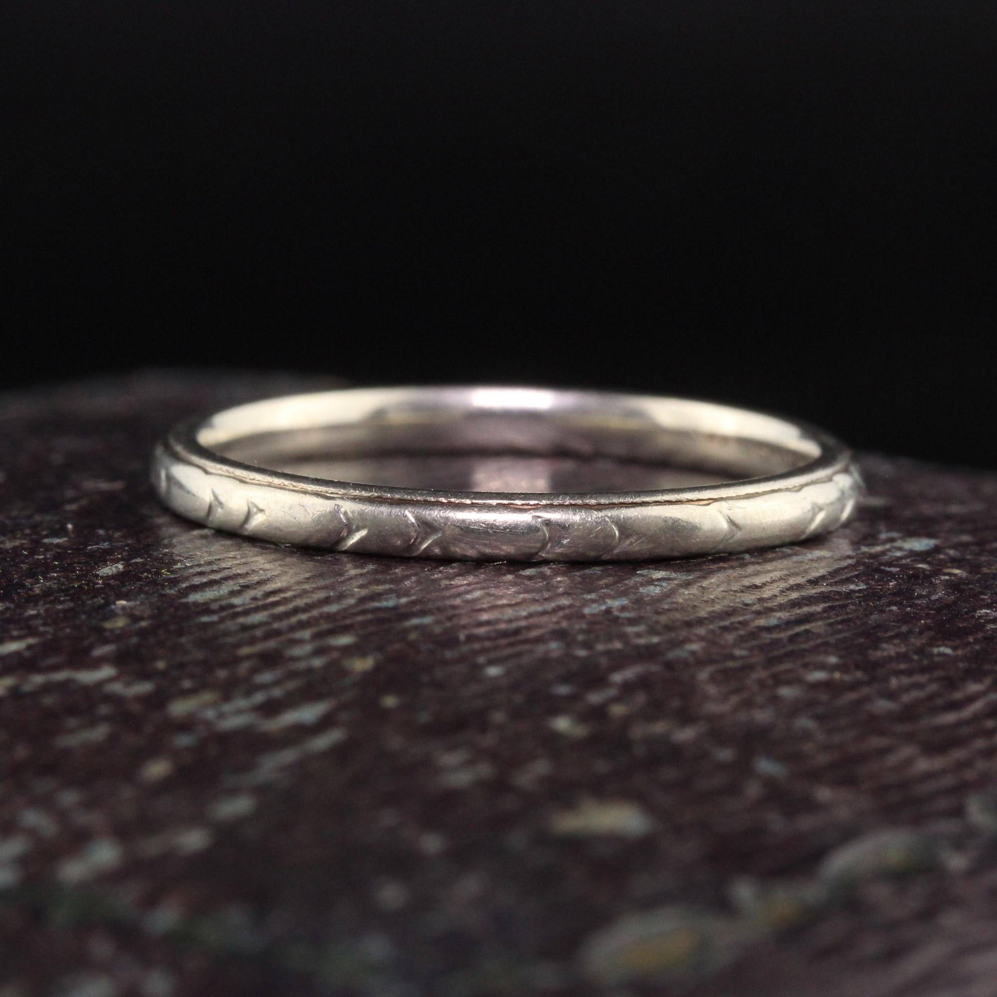 Beautiful Antique Art Deco 18K White Gold Werner Engraved Wedding Band - Size 6. This beautiful wedding band is crafted in 18k white gold. The band has engravings going around the entire ring and the makers mark Werner inside the band.

Item