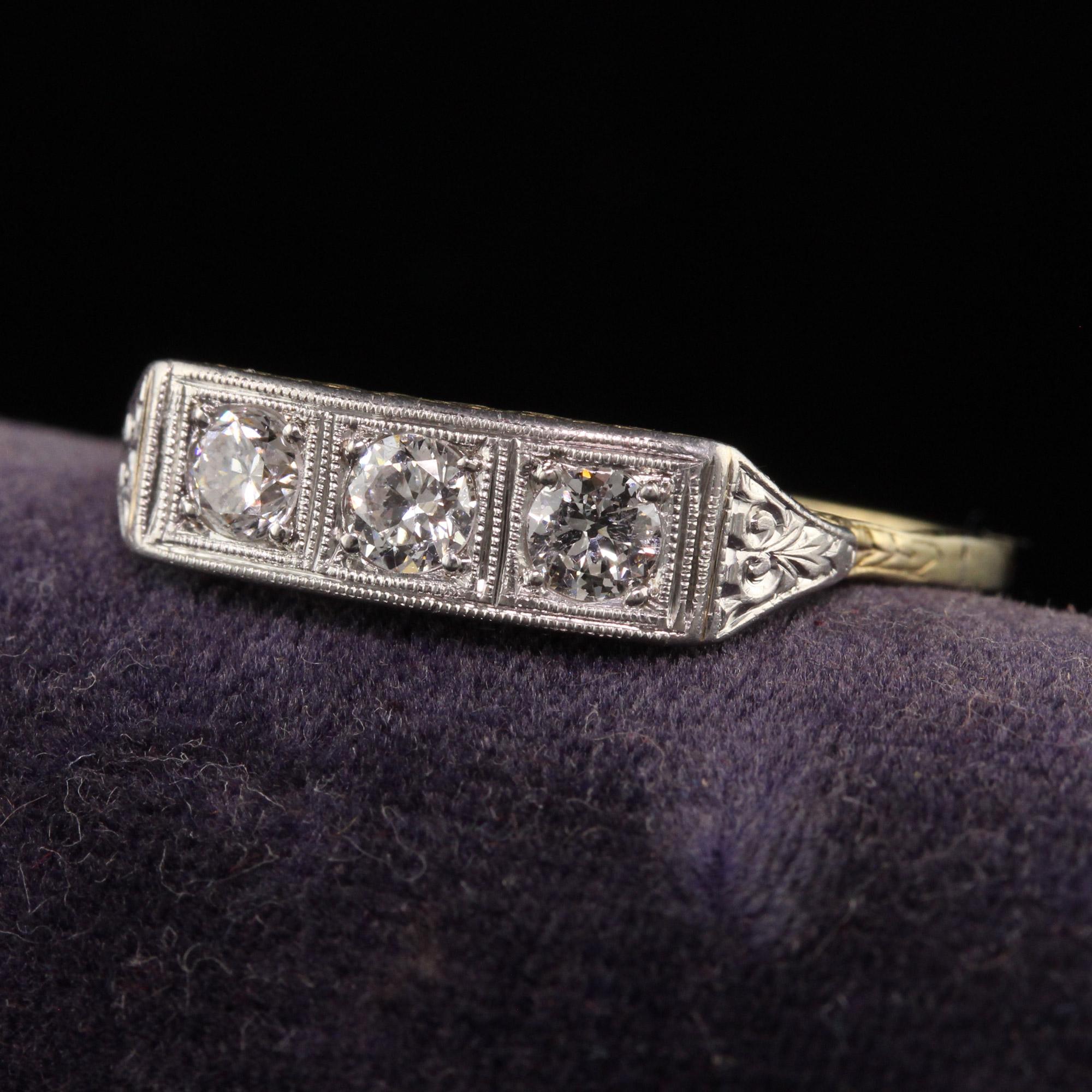 Beautiful Antique Art Deco 18K Yellow Gold and Platinum Three Diamond Filigree Ring. This beautiful three stone ring is crafted in 18k yellow gold and platinum. The ring has three old european cut diamonds and has gorgeous filigree work on the
