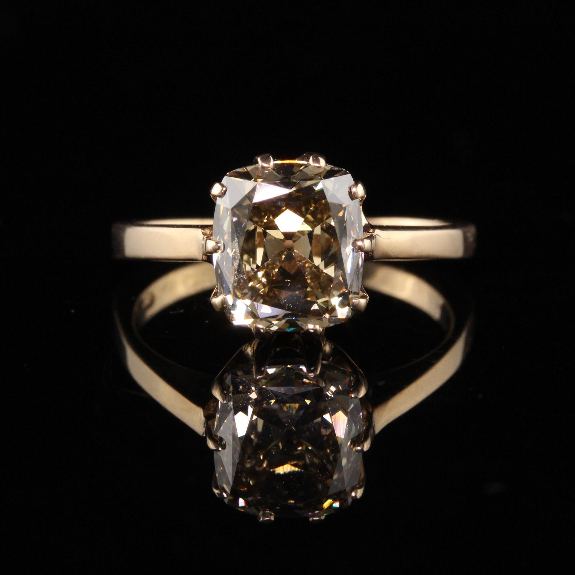 Beautiful Antique Art Deco 18K Yellow Gold Fancy Yellow Old Mine Diamond Engagement Ring. This gorgeous engagement ring is crafted in 18k yellow gold. The center holds a large fancy Yellow - Brown old mine cut diamond in the center of a classic