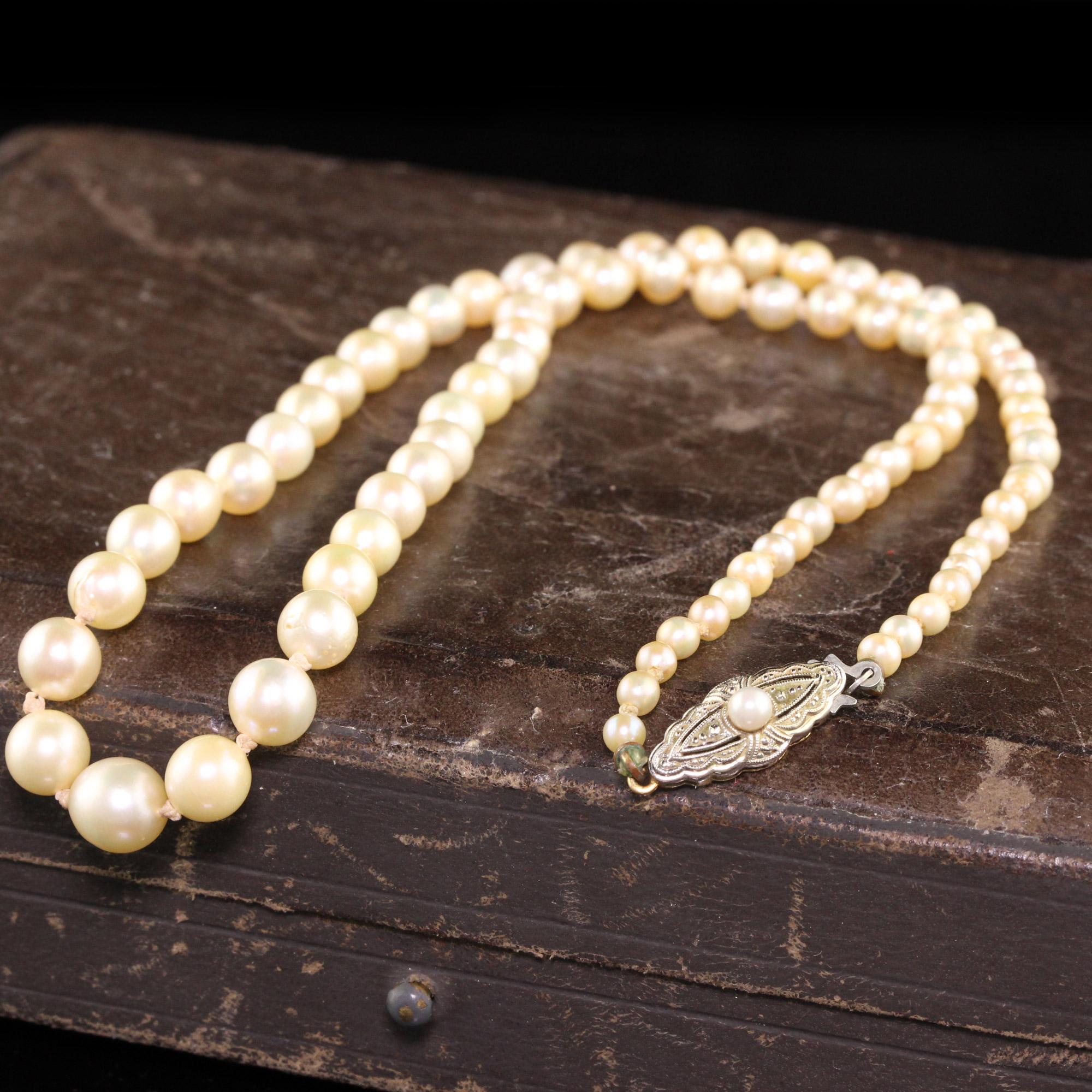 Beautiful Antique Art Deco 18K Yellow Gold Natural Pearl Akoya Pearl Strand Necklace. This classic strand of pearls has a GIA report on it stating that the pearls are saltwater Akoya and has 2 natural pearls as well on the strand.

Item