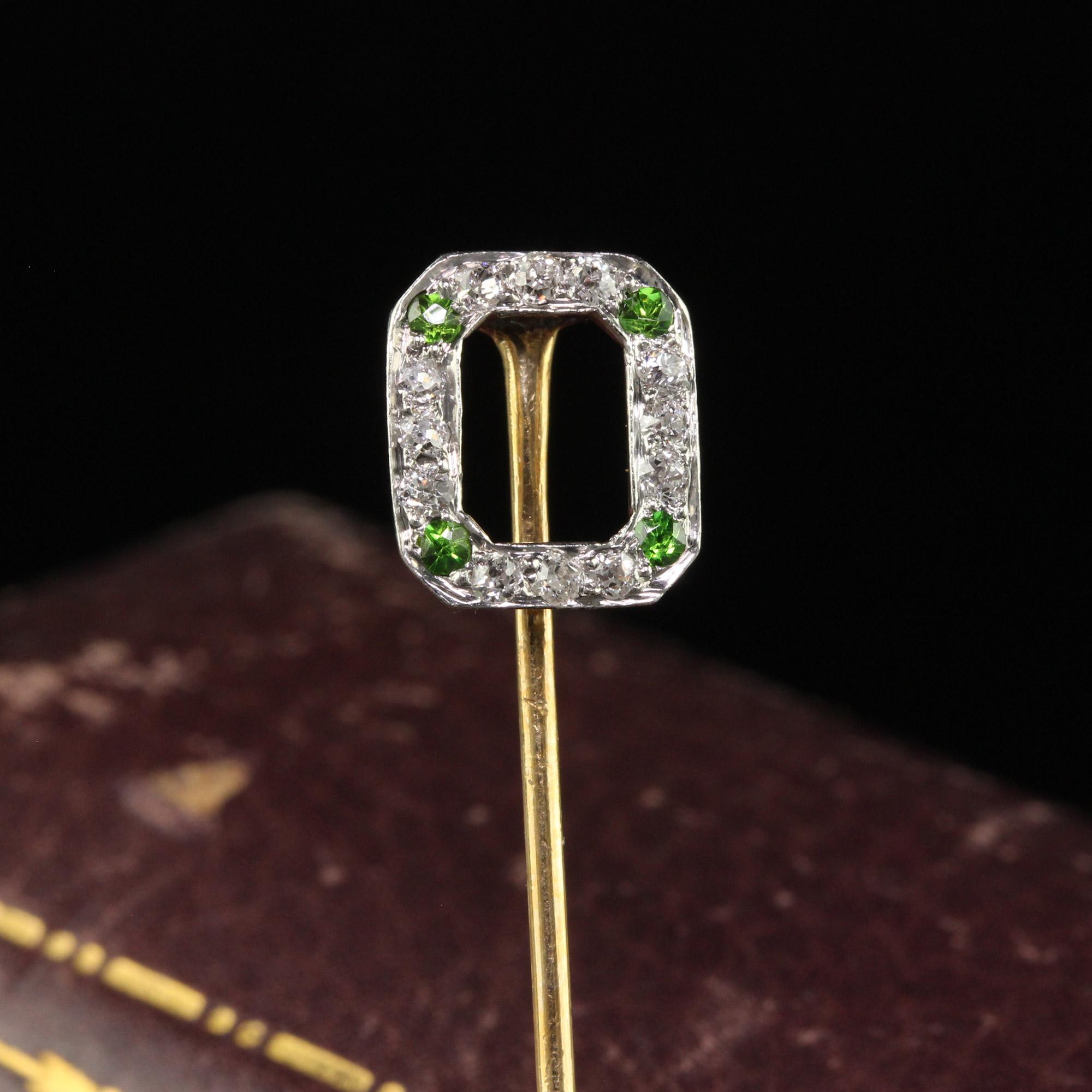Beautiful Antique Art Deco 18K Yellow Gold Old Cut Diamond and Demantoid Stick Pin. This beautiful Art Deco stick pin is crafted in 18k yellow gold and platinum top. The pin features old cut diamonds and demantoid garnets on each corner. The pin has