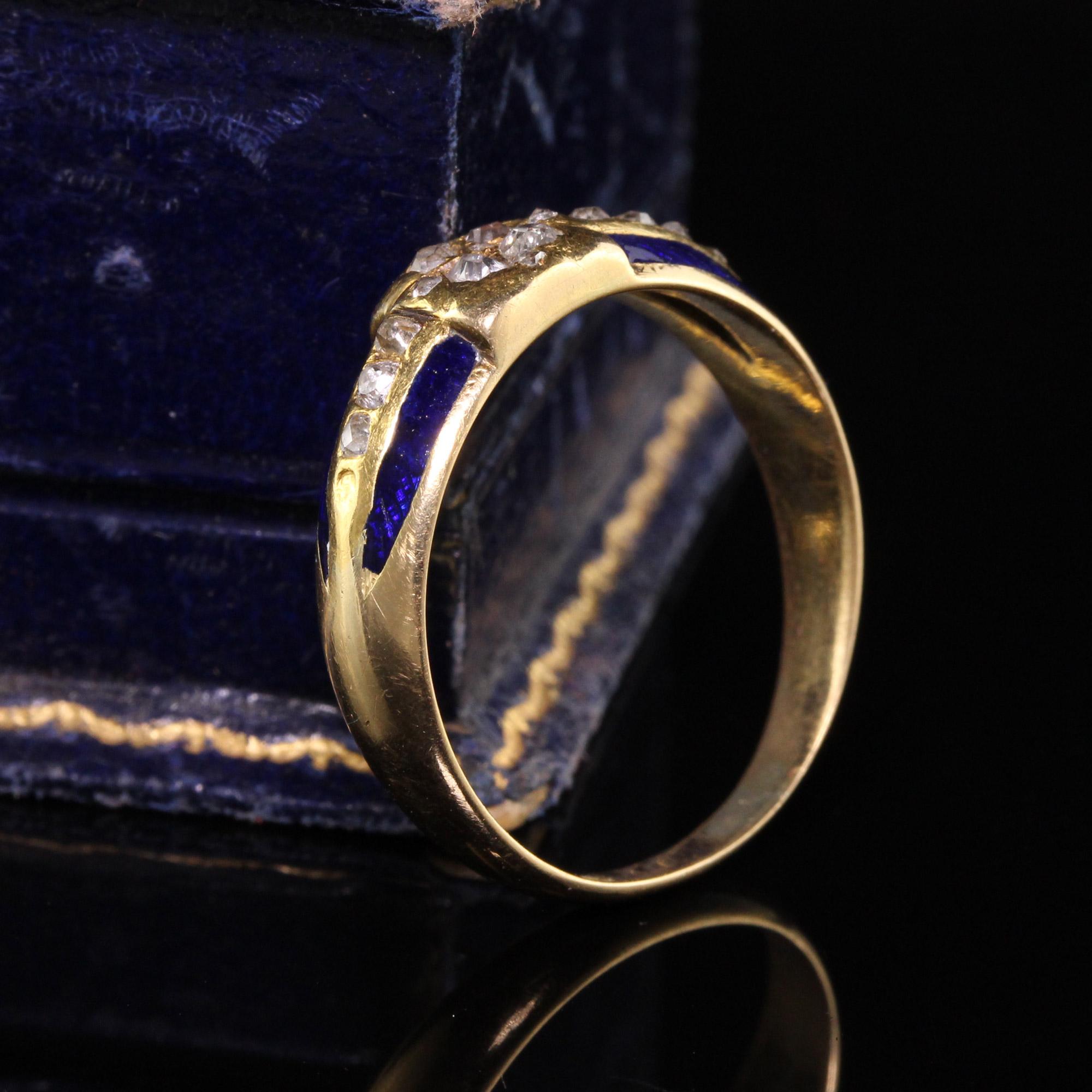 Magnificent Antique Art Deco 18K Yellow Gold Old Mine Cut Diamond Enamel Ring. The sides of the ring have blue enamel and the diamonds on the ring are chunky old mine cut stones in different shapes. A very unique ring.

#R0783

Metal: 18K Yellow