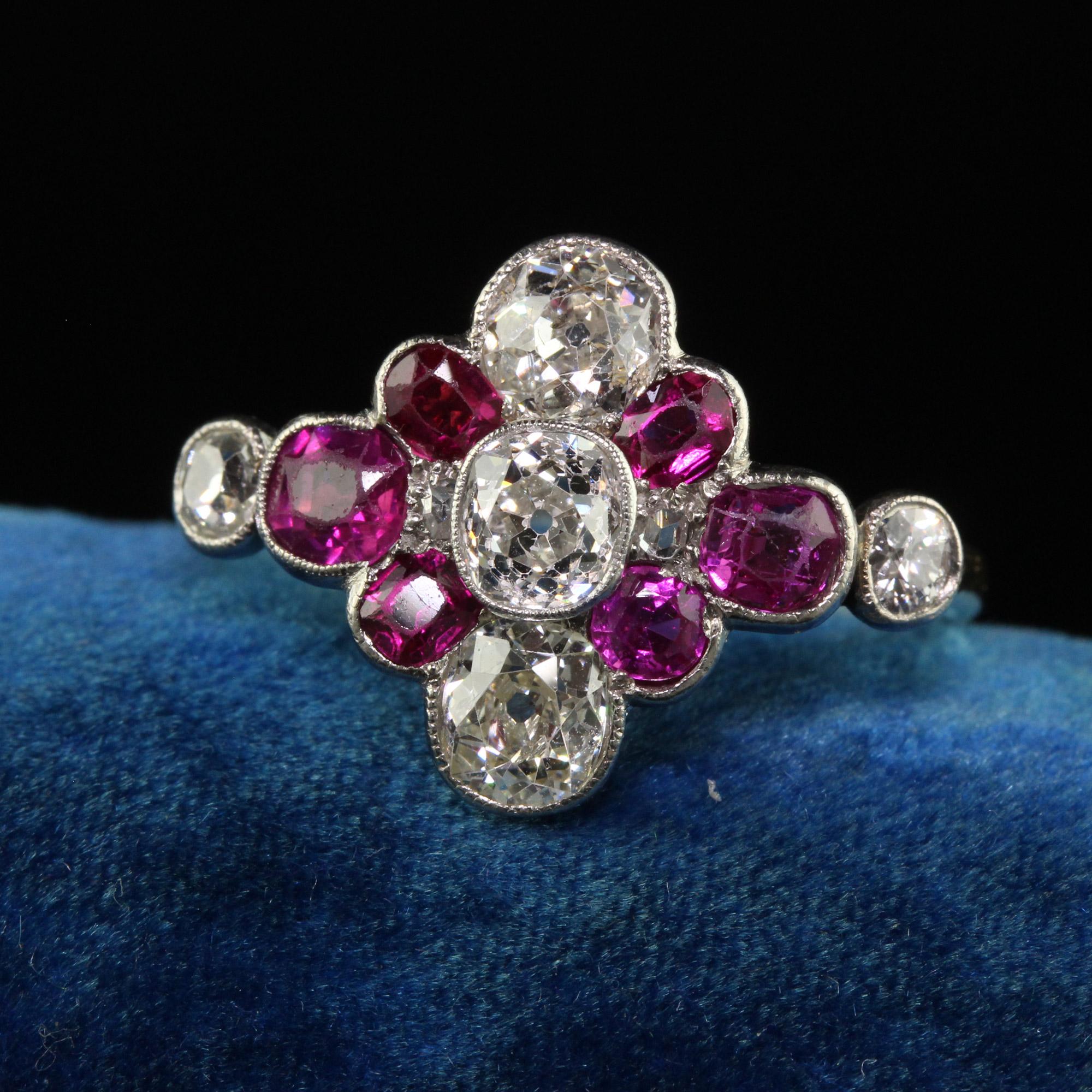 Beautiful Antique Art Deco 18K Yellow Gold Old Mine Diamond and Ruby Floral Ring. This incredible Art Deco ring is crafted in 18k yellow and white gold. The center holds three large old mine cut diamonds and has three natural rubies flare outward.