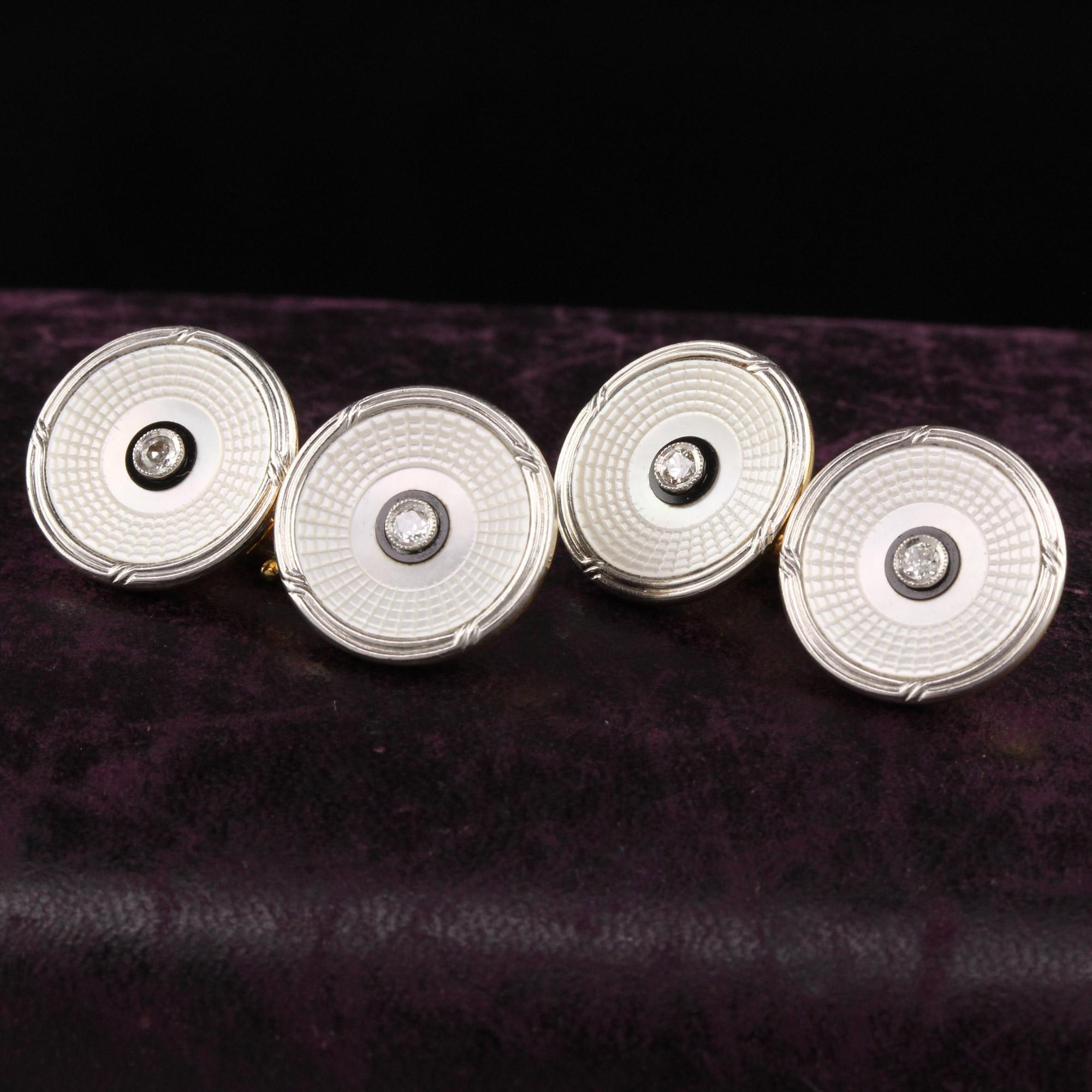 Beautiful Antique Art Deco 18K Yellow Gold Platinum Diamond Mother of Pearl Cufflinks. This beautiful pair of cufflinks has an old mine cut diamond in the middle of a beautifully engraved mother of pearl panel that has enamel on it as well.

Item