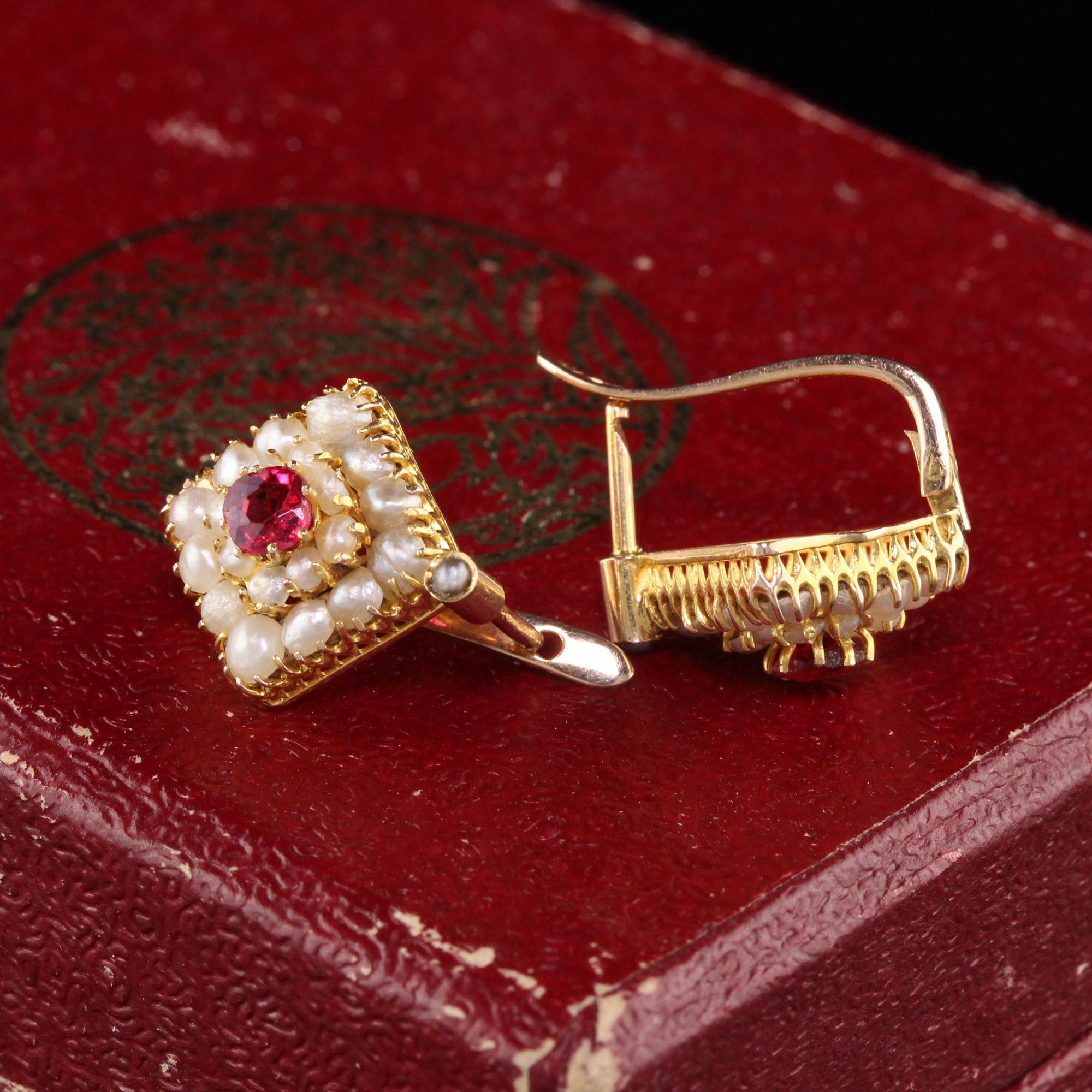 Gorgeous Antique Art Deco 18K Yellow Gold Seed Pearl Ruby Diamond Earrings. These earrings feature seed pearls on the ring with an old cushion ruby in the center.

Item #E0039

Metal: 18K Yellow Gold

Ruby: Approximately .60 cts

Weight: 2.8