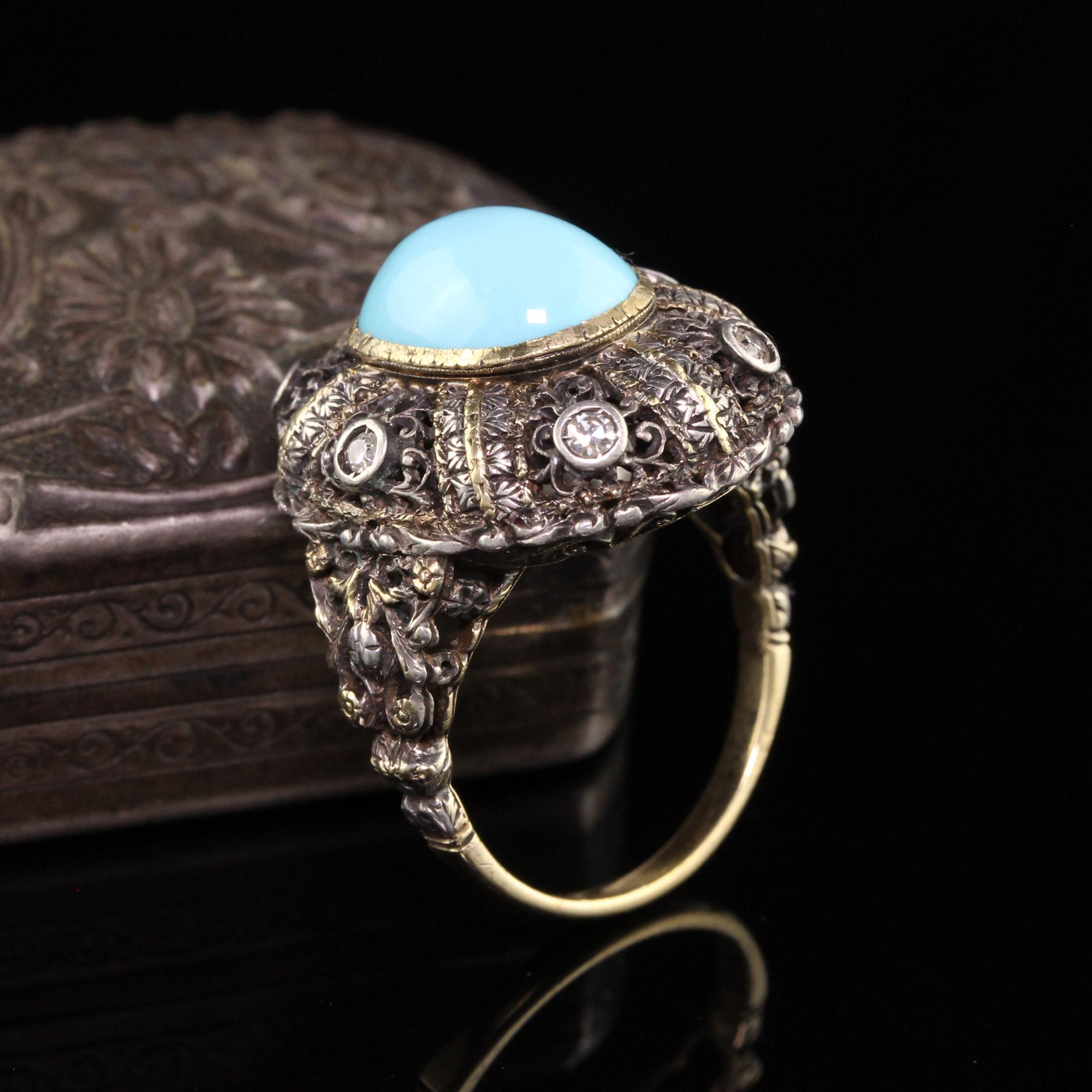 Beautiful Antique Art Deco 18K Yellow Gold Silver Top Turquoise Cabochon Ring. This gorgeous ring features a nice cabochon turquoise set in a filigree mounting with single cut stones set in it.

Item #R0847

Metal: 18K Yellow Gold and Silver