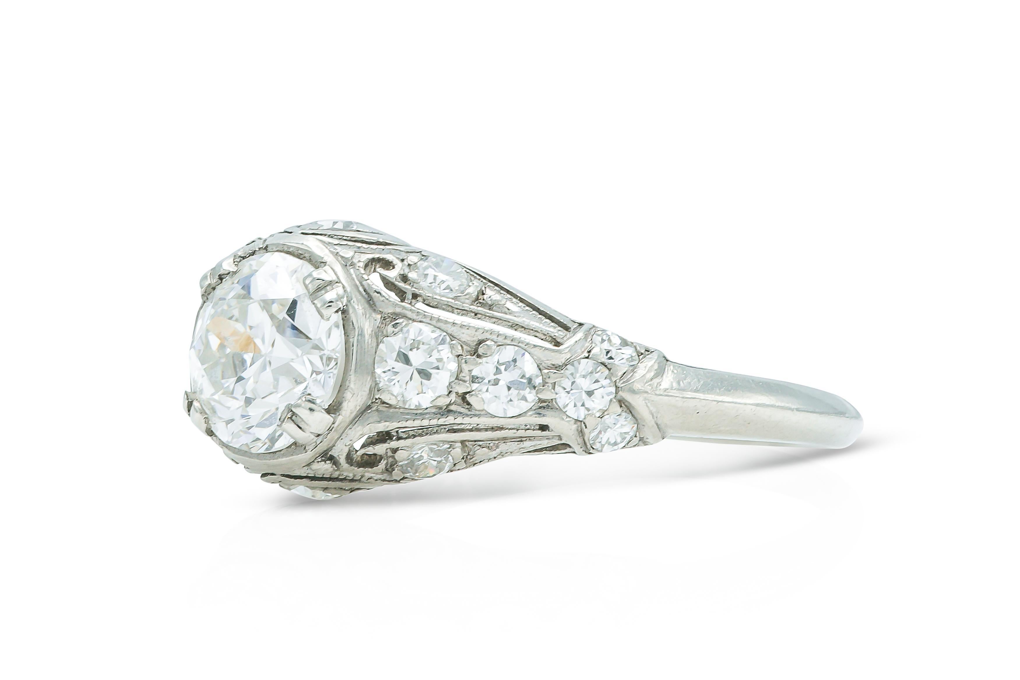 Finely crafted in platinum with an Old Mine cut Diamond at the center weighing approximately 0.80 carat, H color, VS2 clarity.
The ring features smaller accenting Round cut Diamonds on the setting weighing a total of approximately 0.40 carat. 
Circa