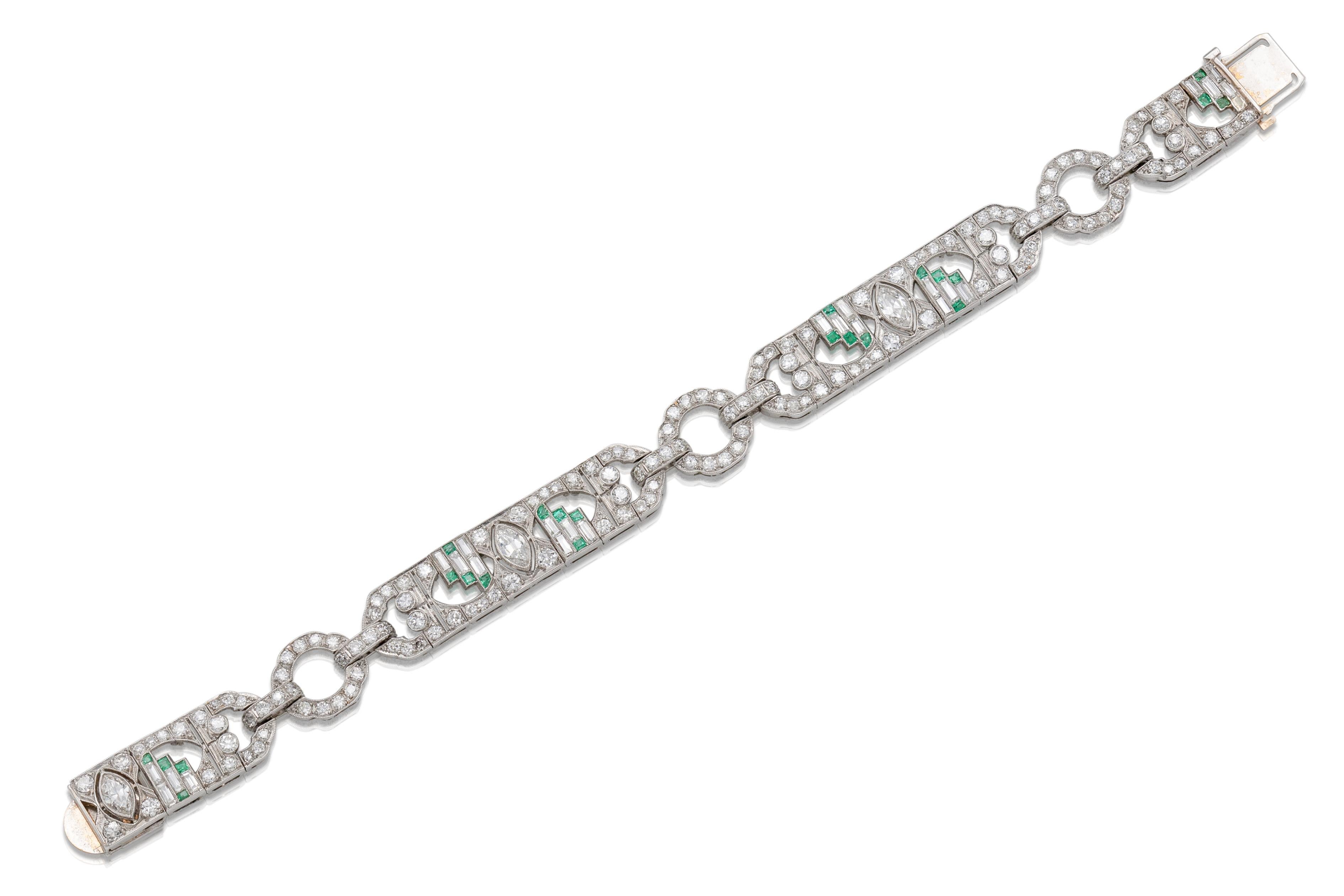 Finely crafted in platinum with 3 Marquise, 24 Baguette, and 156 Old European cut Diamonds weighing approximately a total of 10.00 carats, and Square cut Emeralds.
Circa 1920s
Size 7 inches