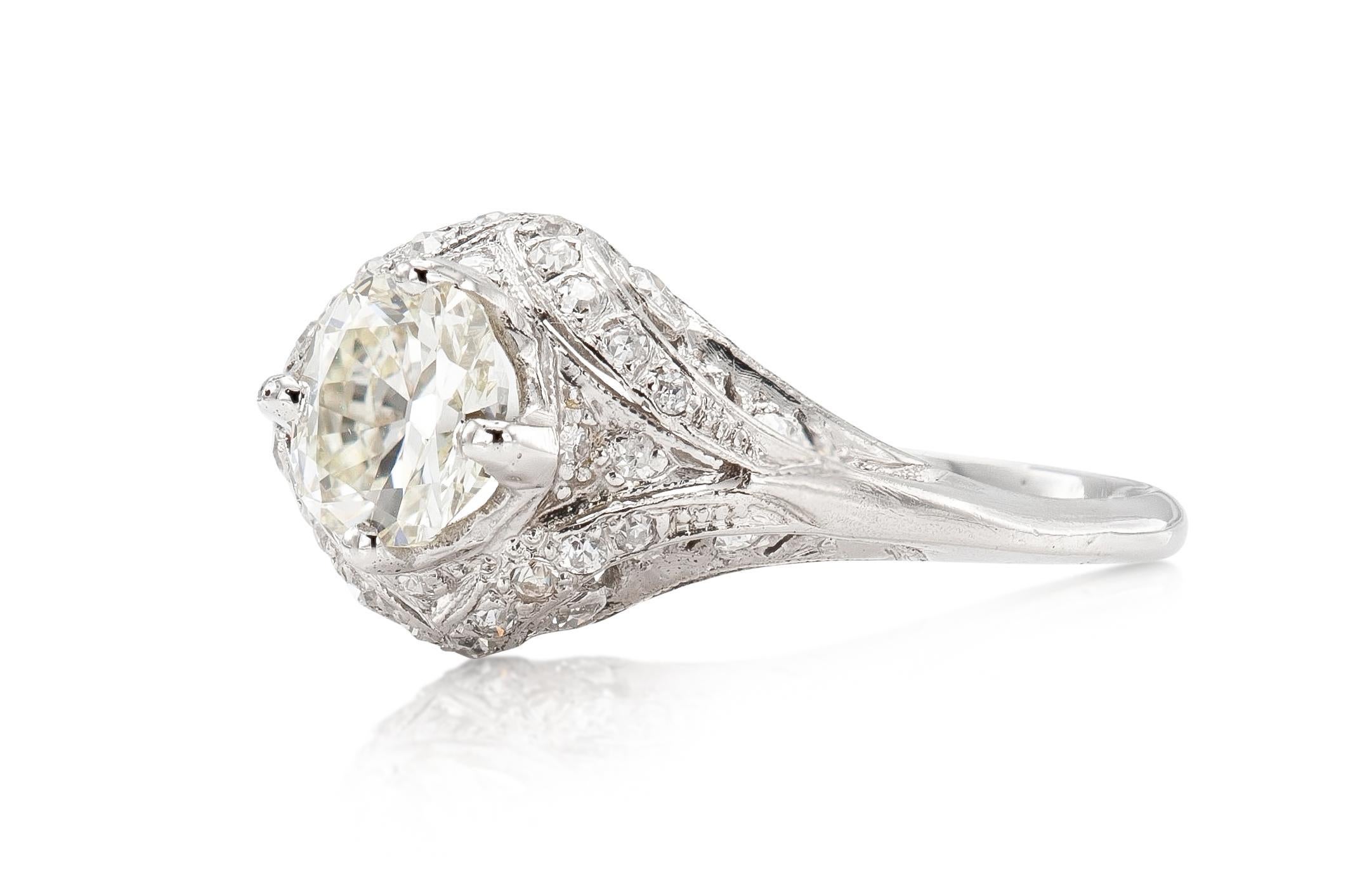 Finely crafted in platinum with an Old European cut Diamond weighing approximately 1.01 carat, M-N color, VS2 clarity.
The ring features small accenting Old European cut Diamonds on the setting.
Circa 1920s
Size 8 1/2, resizable