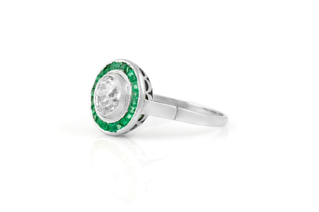 Finely crafted in platinum featuring a center Old Mine cut Diamond weighing approximately 1.50 carat, I-J color, SI1-SI2 clarity, with surrounding Square cut Emeralds.
Circa 1920s
Size 7 1/4, resizable