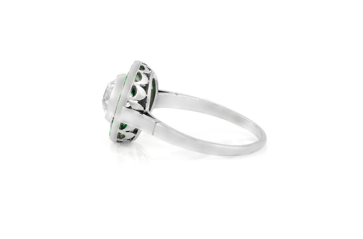 Antique Art Deco 1920s 1.50 Carat Old Mine Cut Diamond Target Ring with Emeralds In Good Condition For Sale In New York, NY