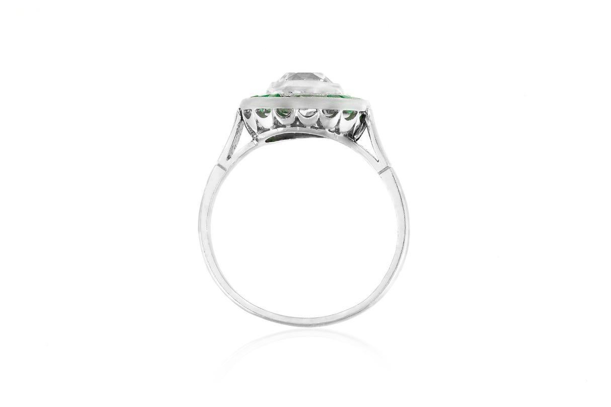 Women's Antique Art Deco 1920s 1.50 Carat Old Mine Cut Diamond Target Ring with Emeralds For Sale