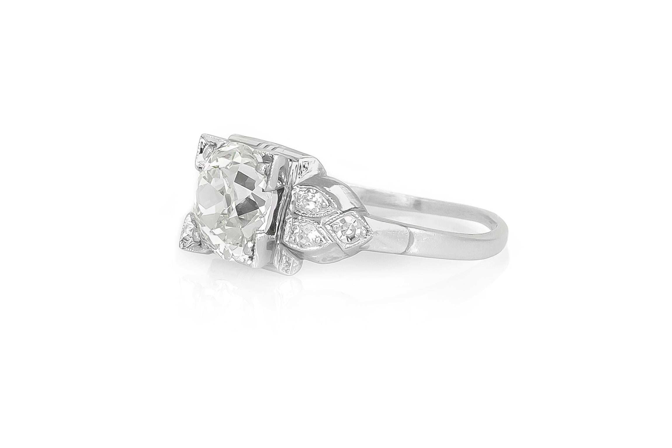 Finely crafted in platinum with an Old Mine cut Diamond at the center weighing approximately 1.75 carats, J color, VS clarity, accented by 3 Single cut Diamonds on each side weighing a total of approximately 0.15 carat. 
Circa 1920s
Size 7, resizable