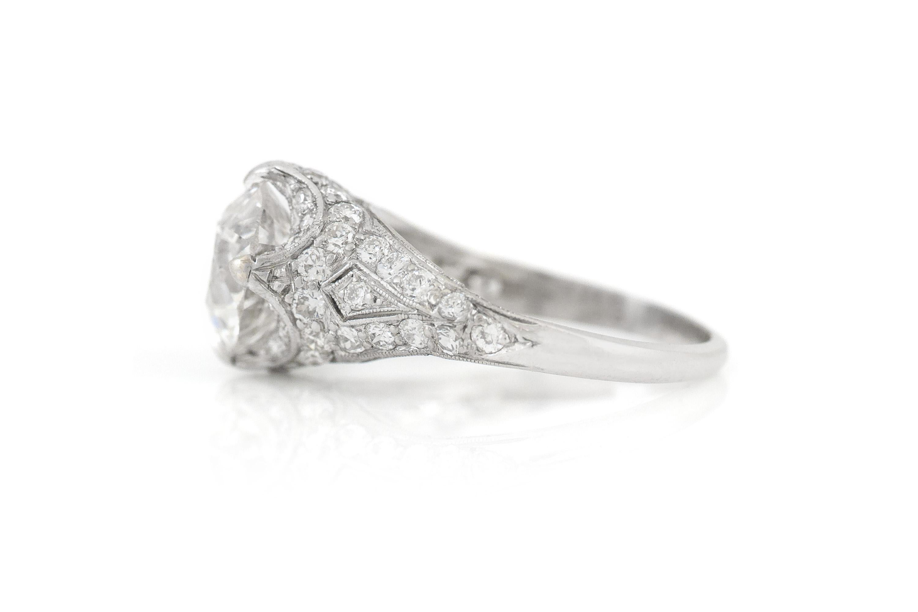 Finely crafted in platinum with a GIA certified Old European cut Diamond weighing 2.15 carats, F color, SI1 clarity, GIA #1146620231.
The ring features small accenting Old European cut Diamonds on the setting.
Circa 1920s
Size 5 1/4, resizable